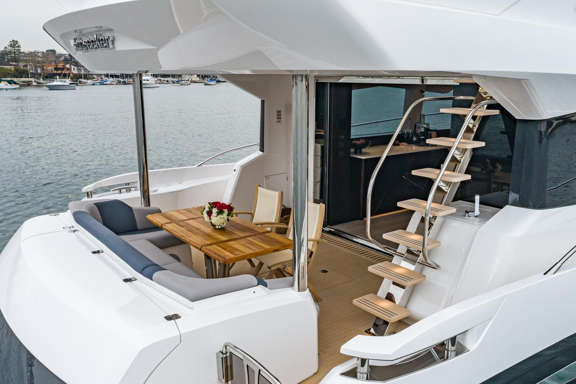 Sunseeker Manhattan 68 Yacht 2023 with stylish deck and staircase.