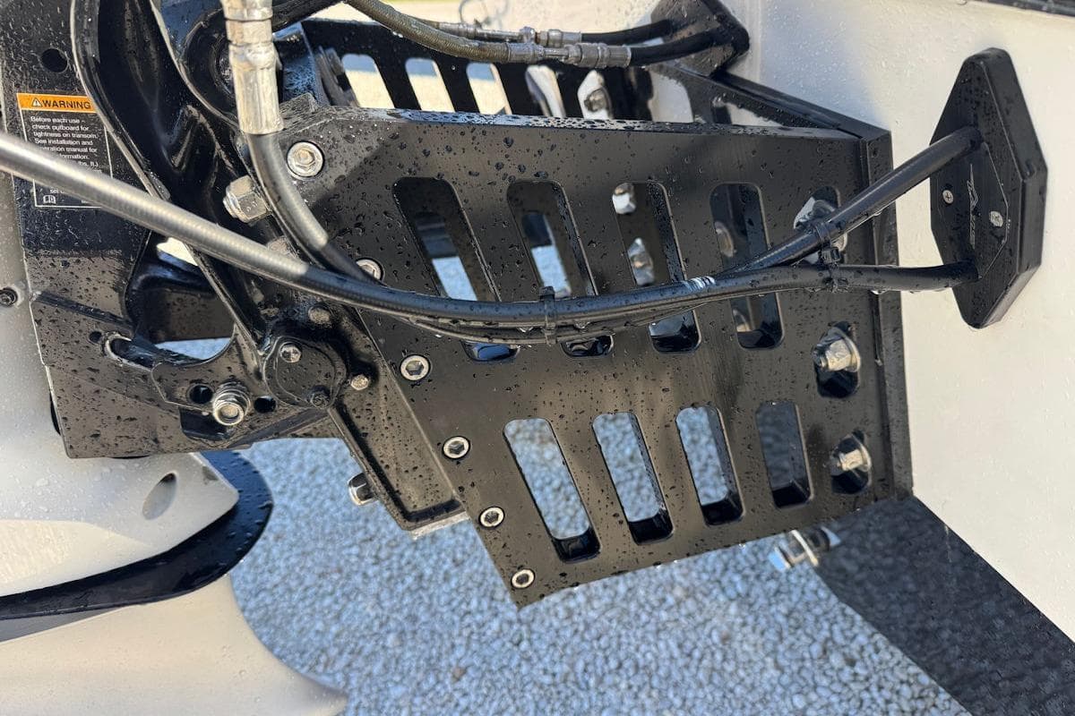 Close-up of a 1988 Activator 22 boat engine mount with cables and bolts.