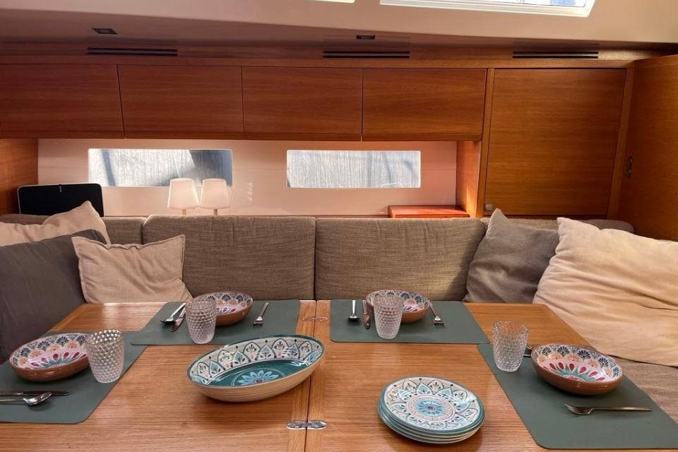 Luxurious Salona Ker 63 yacht interior with elegant dining setup, 2014 model.
