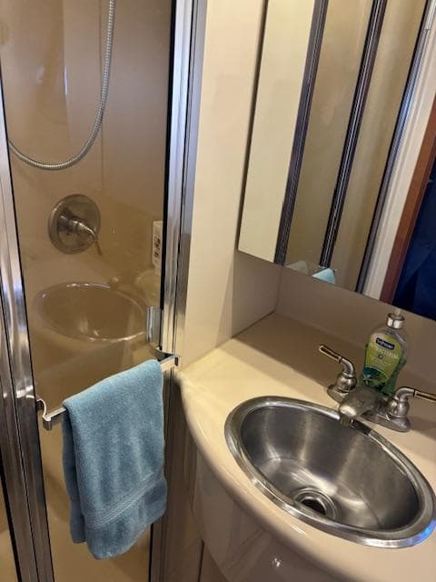 2004 Meridian Sedan Bridge 341 bathroom with shower, sink, and towel.