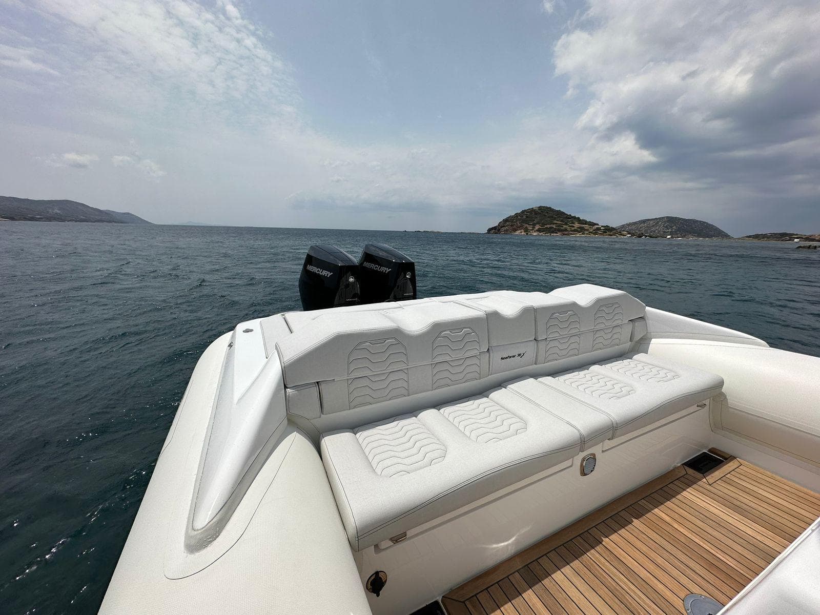 2023 Ribco Seafarer 36X luxury boat with white seating, ocean view.