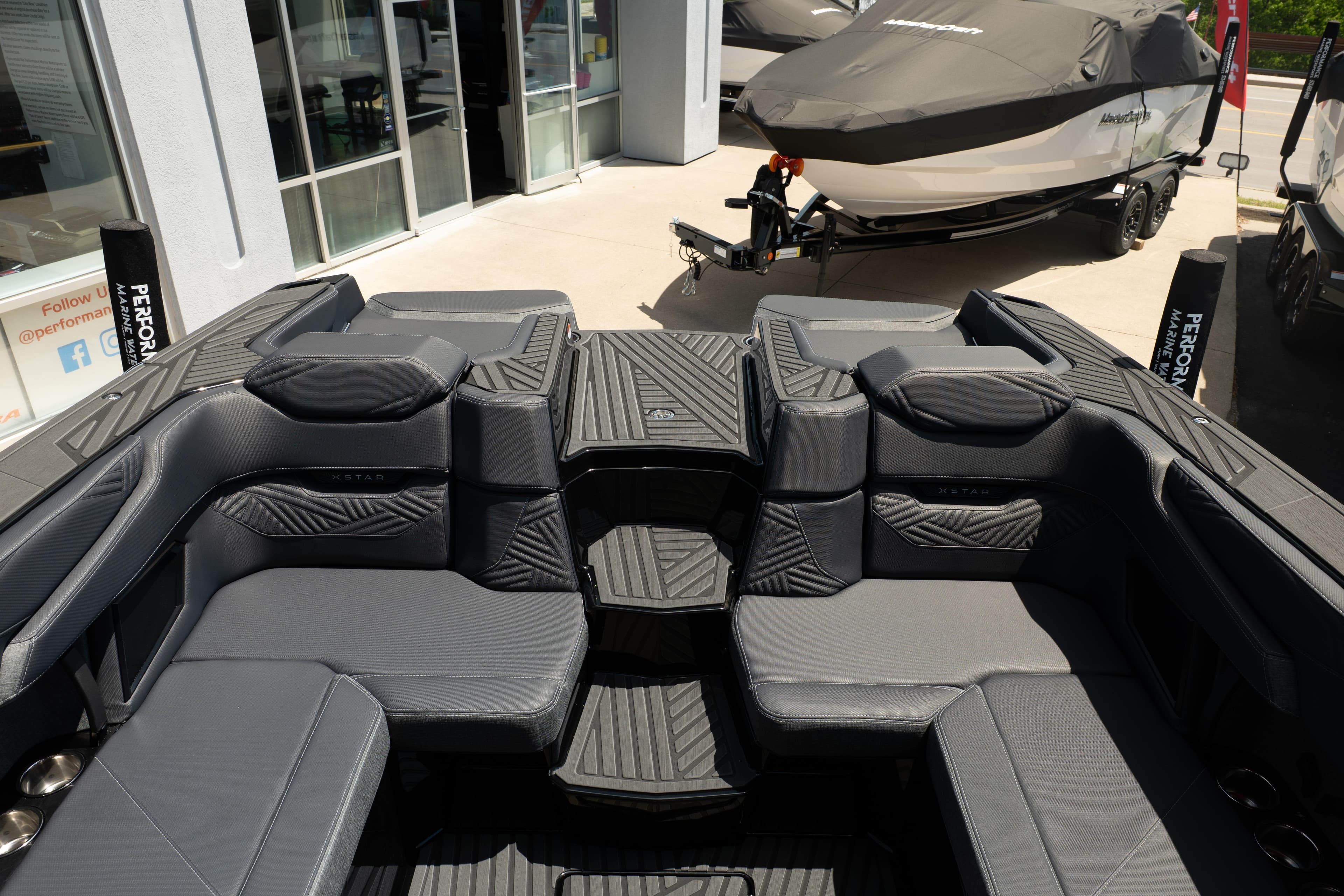 2026 MasterCraft XStar 25 boat interior with sleek gray seating and modern design.