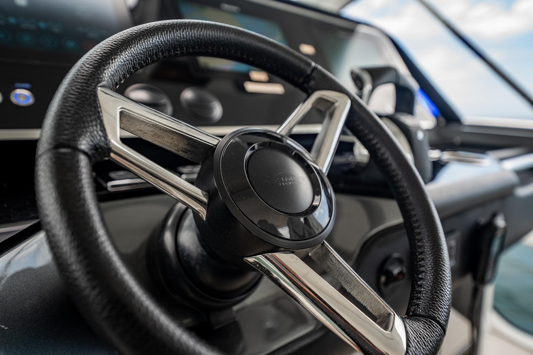 Steering wheel of 2021 Azimut Verve 47 yacht, showcasing luxury design and craftsmanship.