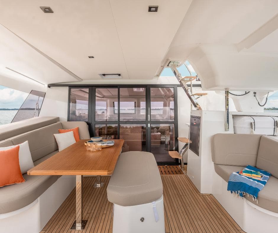 Luxurious interior of 2025 Fountaine Pajot NEW 41 catamaran with elegant seating and dining area.