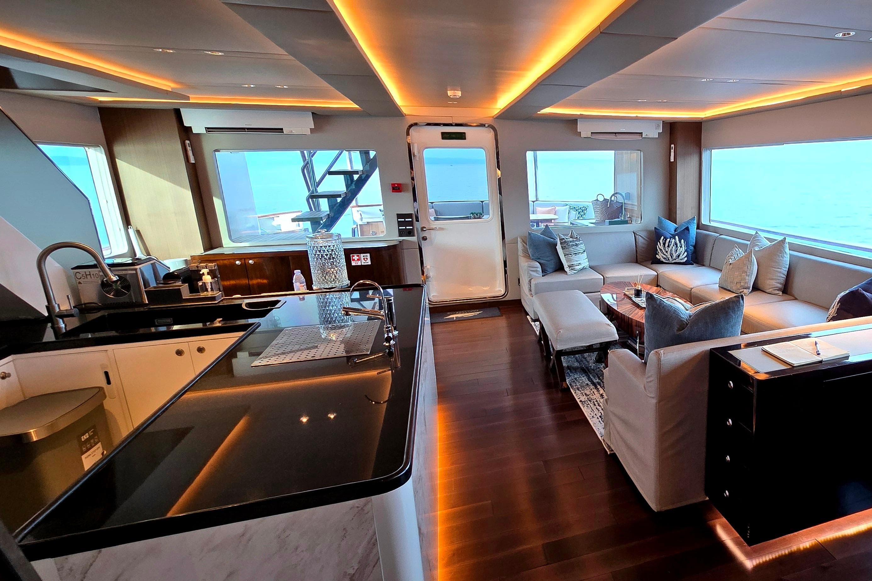 Luxurious interior of 1998 Halter Marine 98 yacht with modern kitchen and cozy seating area.