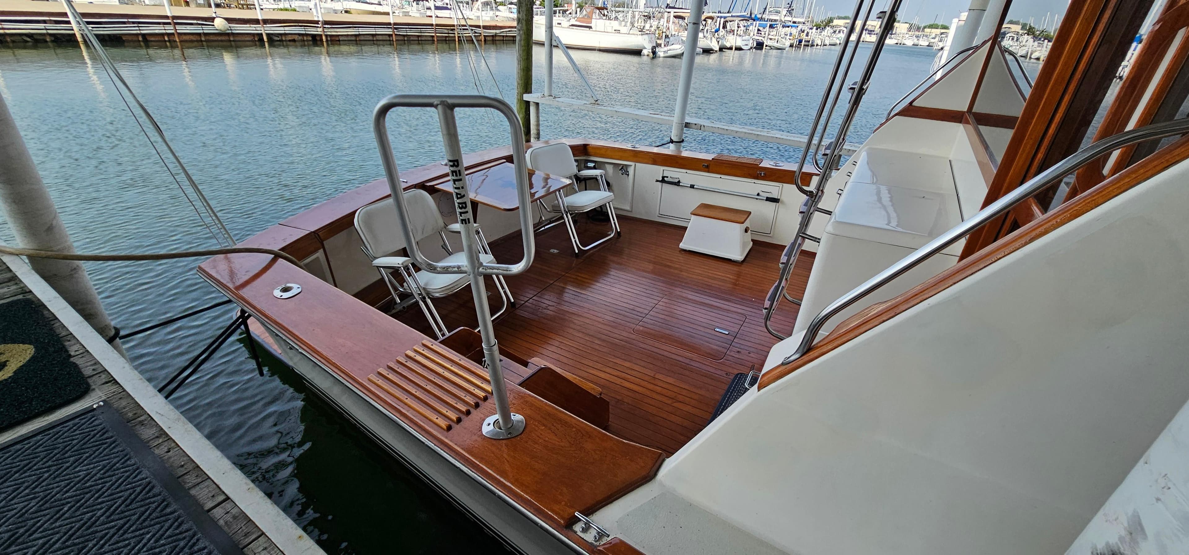 1987 Ocean Yachts 48 Super Sport boat deck with seating at marina.