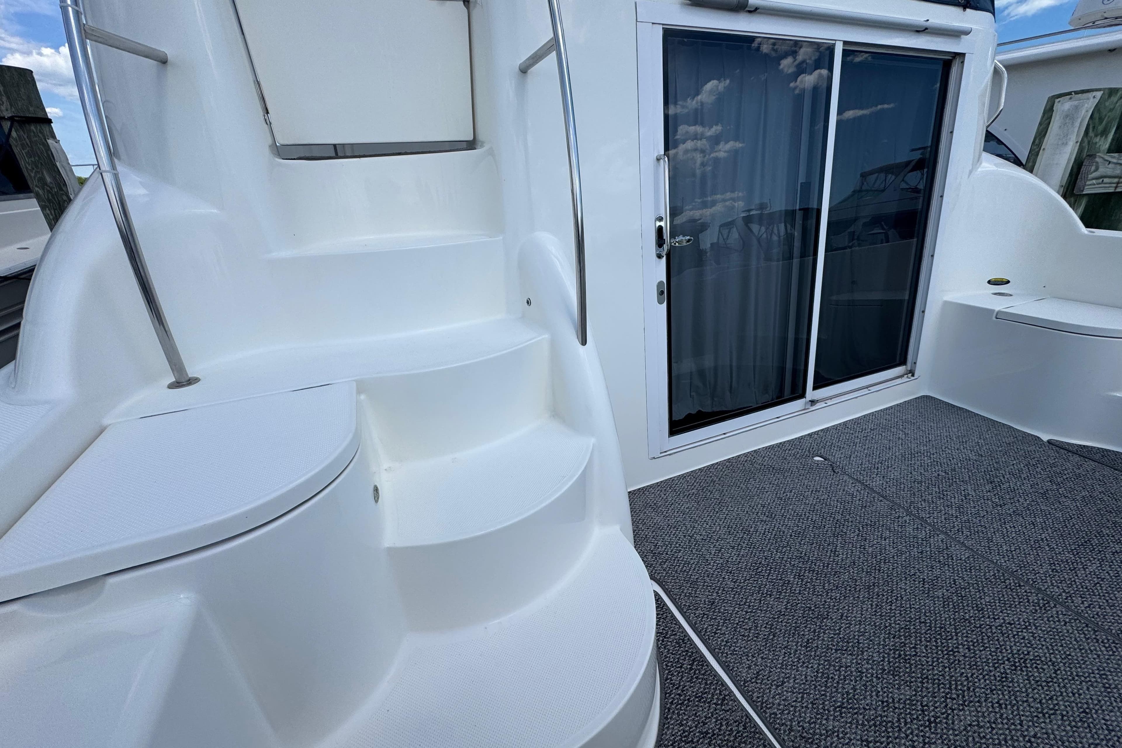 Staircase and sliding door on 2006 Meridian 459 Motoryacht deck.