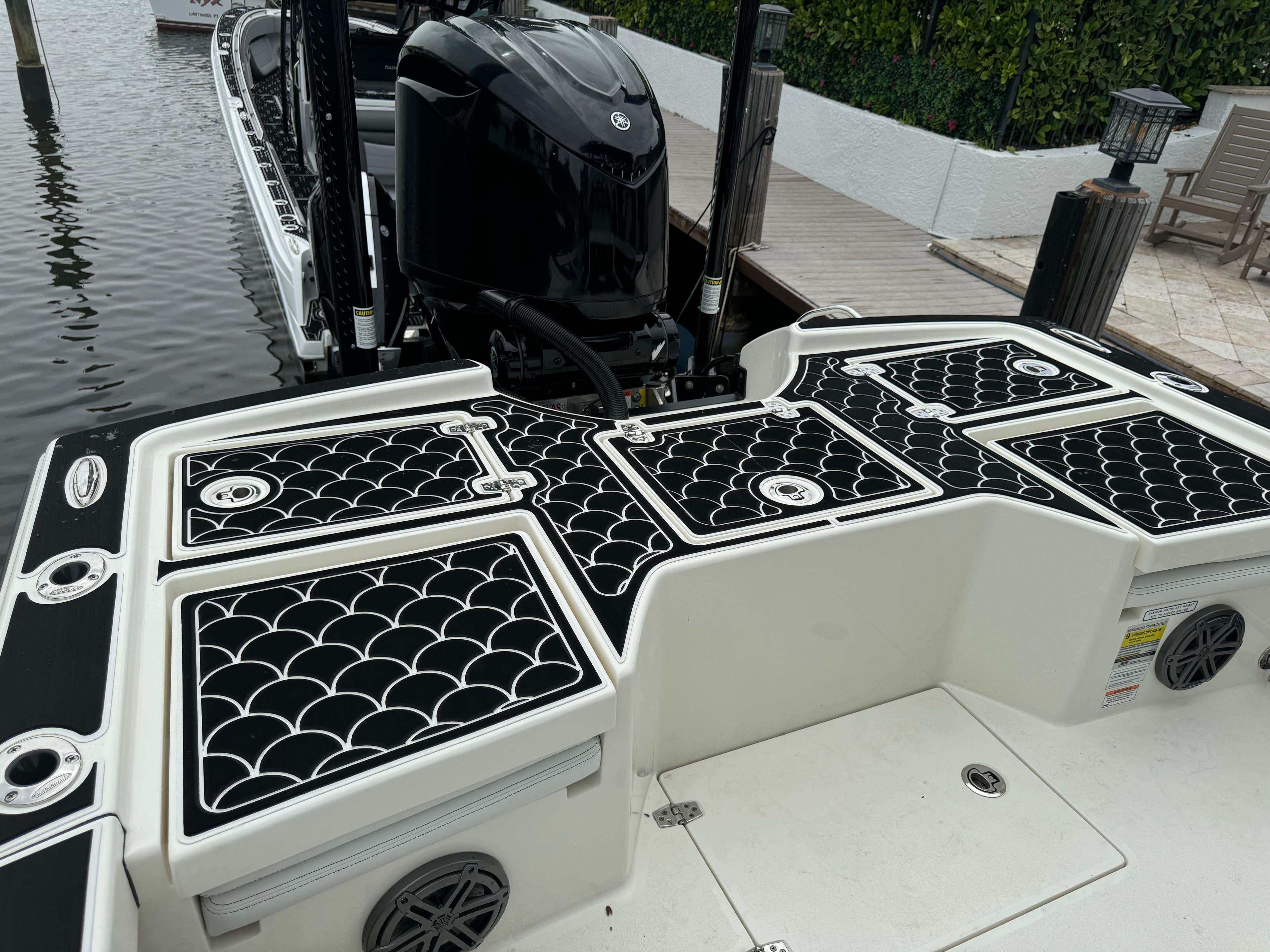 2024 Pathfinder 2500 Hybrid boat with stylish deck design and powerful outboard motor.