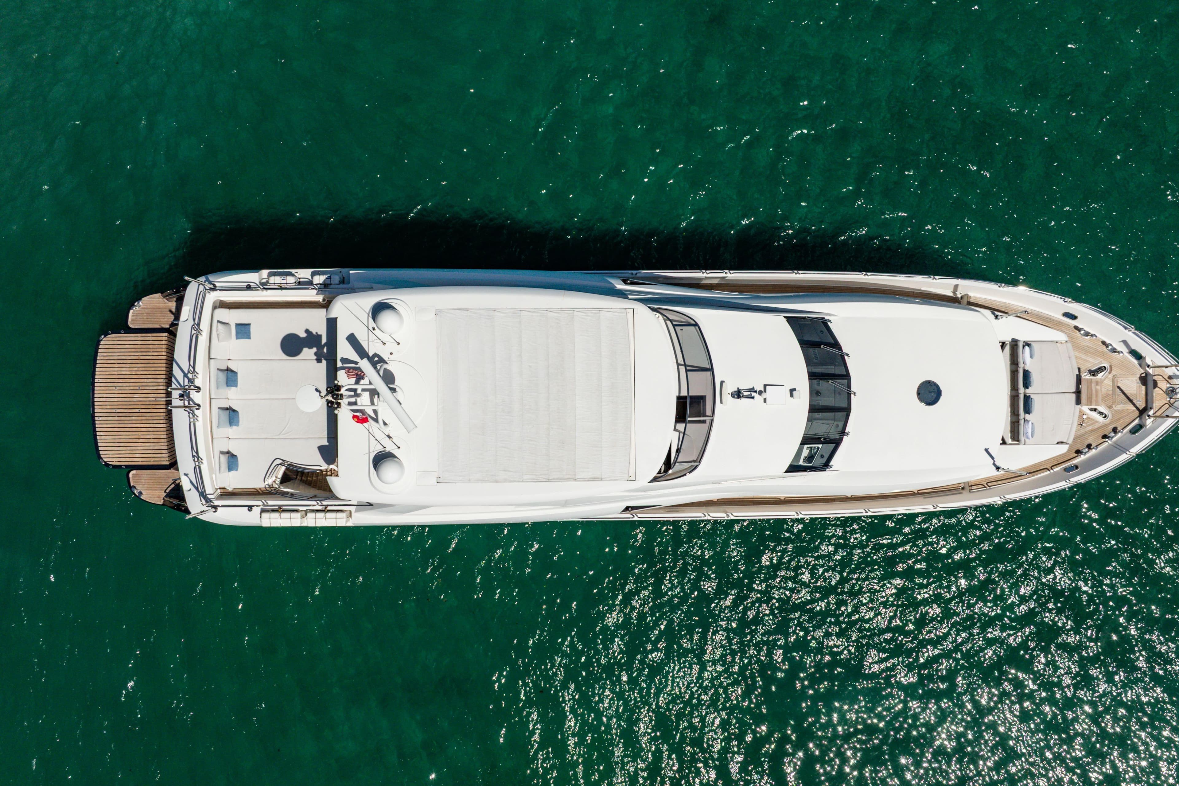 Overhead view of 2011 Sunseeker 34 Metre Yacht on clear turquoise water.