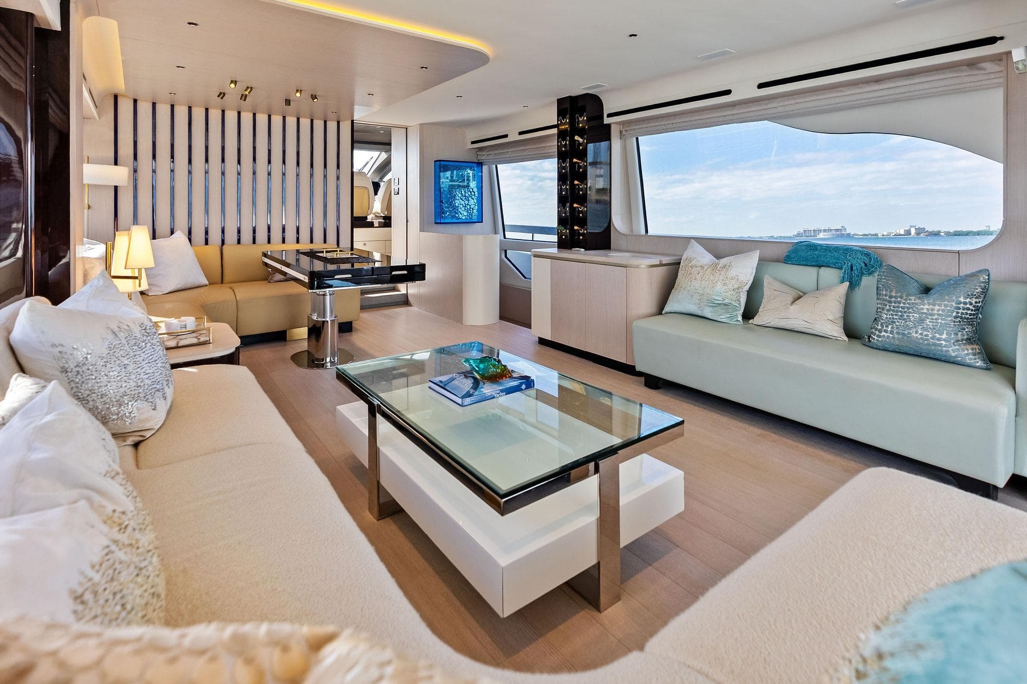 Luxurious interior of 2021 Azimut Fly 78 yacht with elegant seating and panoramic windows.