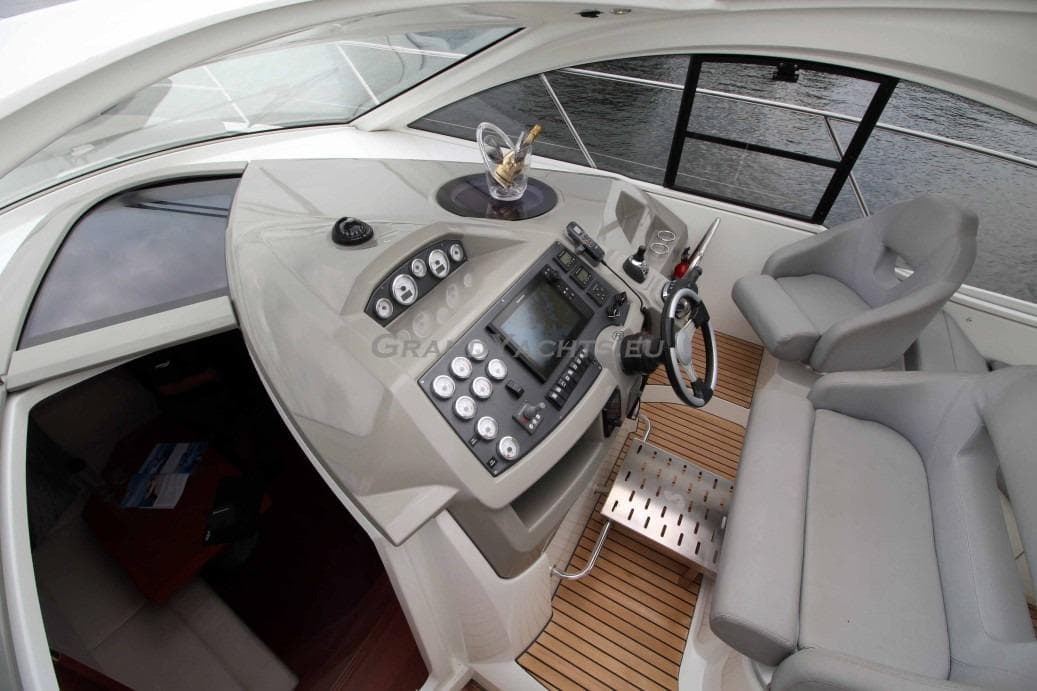 Cockpit of 2011 Beneteau Gran Turismo 38 with modern controls and seating.