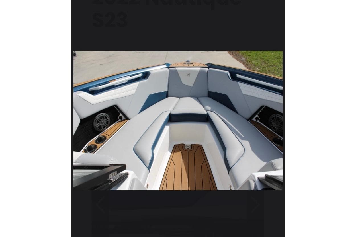 2022 Nautique Super Air Nautique S23 boat interior with sleek seating and modern design.