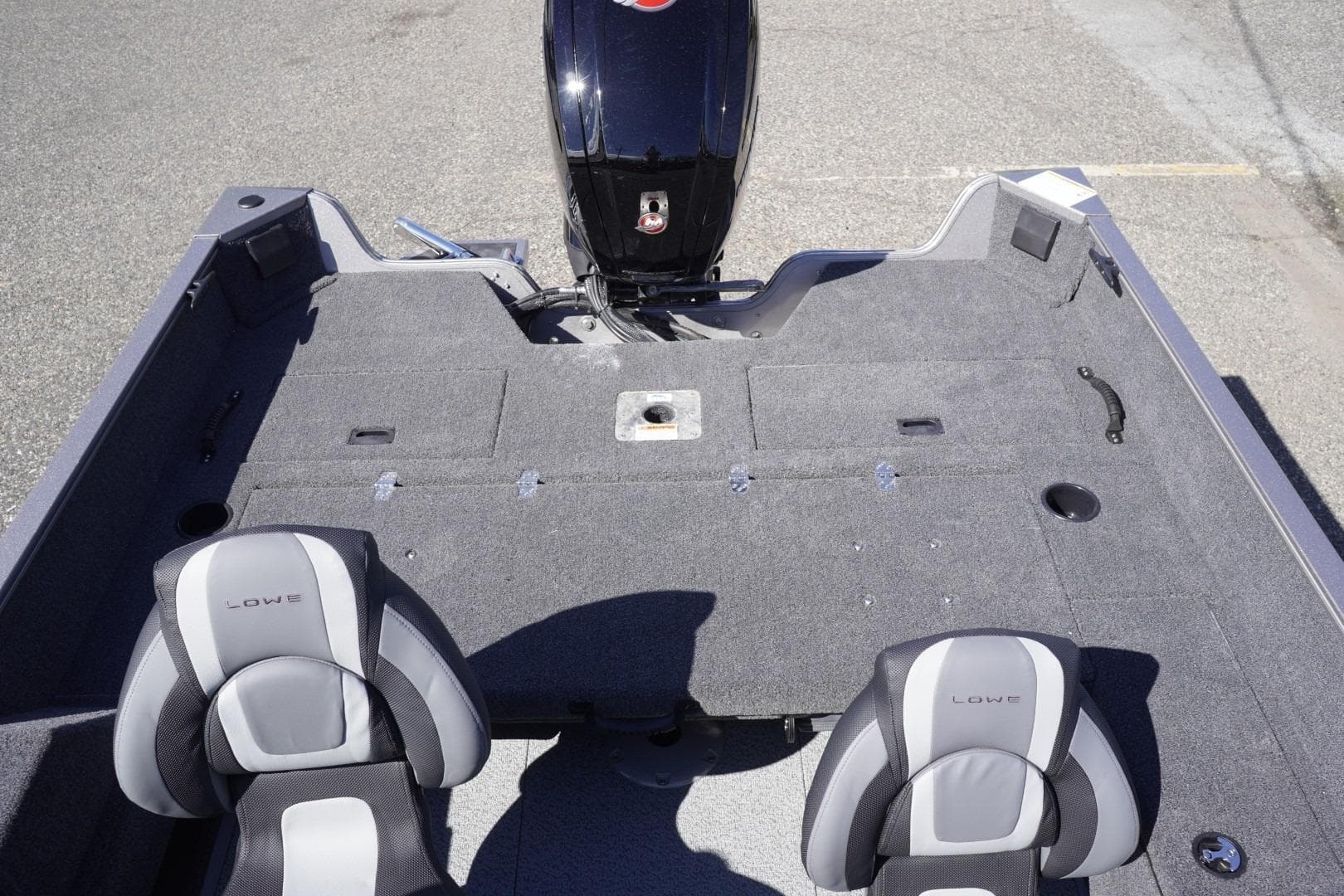 2026 Lowe Fishing Machine 1775WT interior with two seats and motor, ideal for fishing.