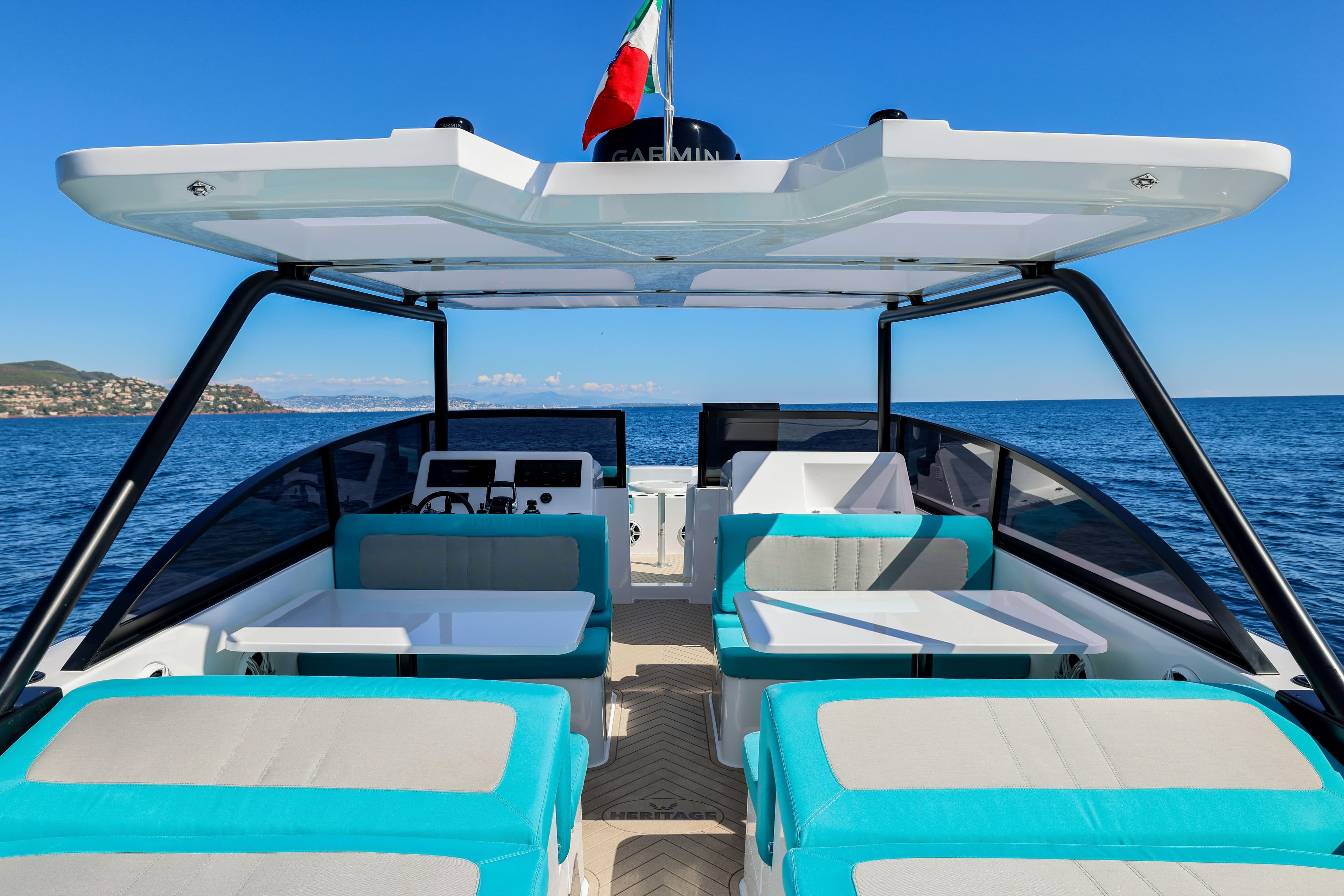 2025 Canados Heritage 36 yacht interior with turquoise seating, open sea view.
