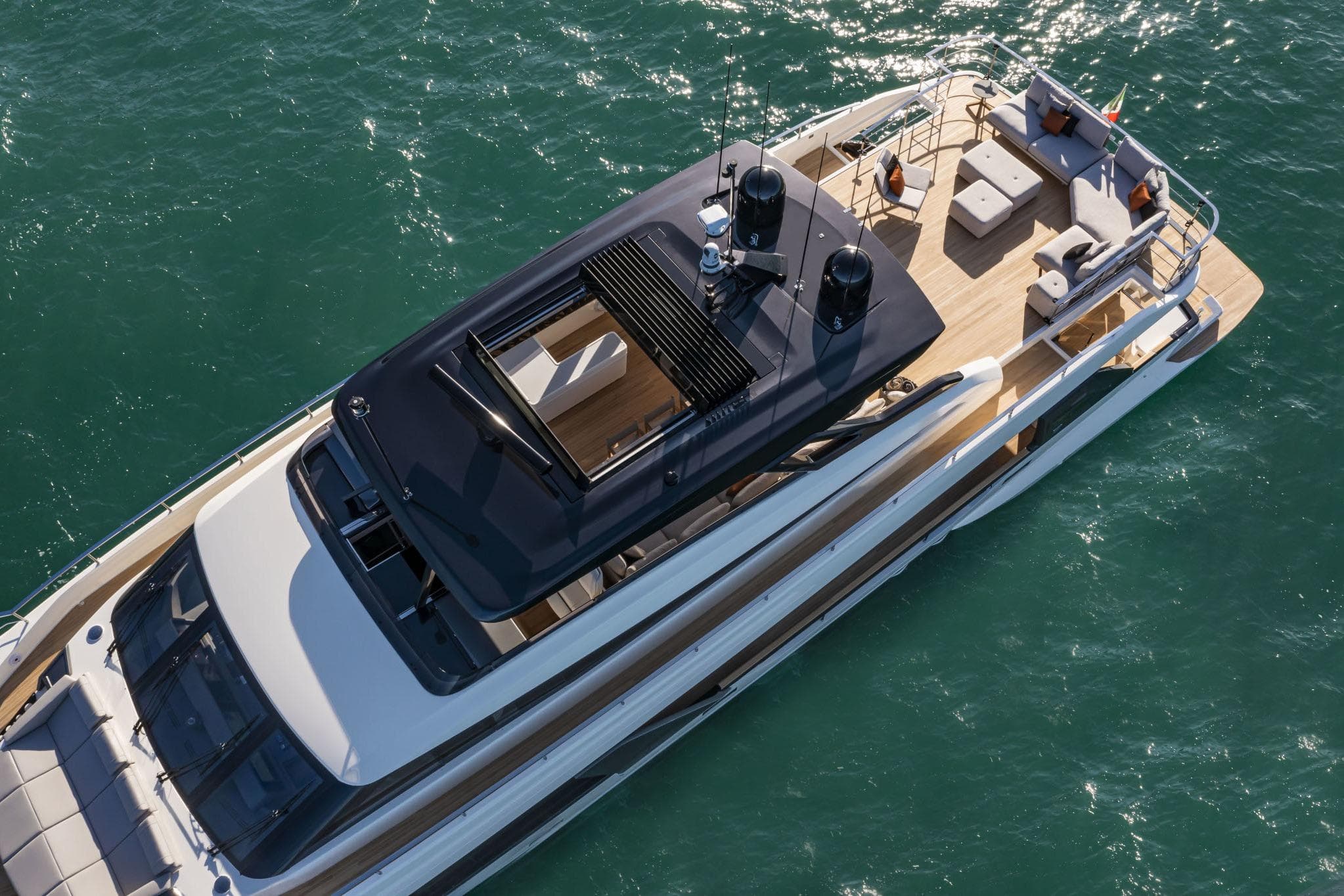 2023 Ferretti Yachts 1000 luxury yacht cruising on clear blue waters.