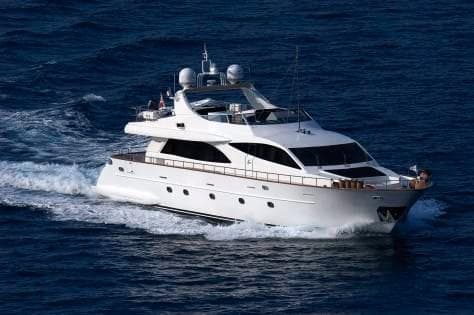 Luxury Falcon 90 yacht cruising on open sea, 2006 model.