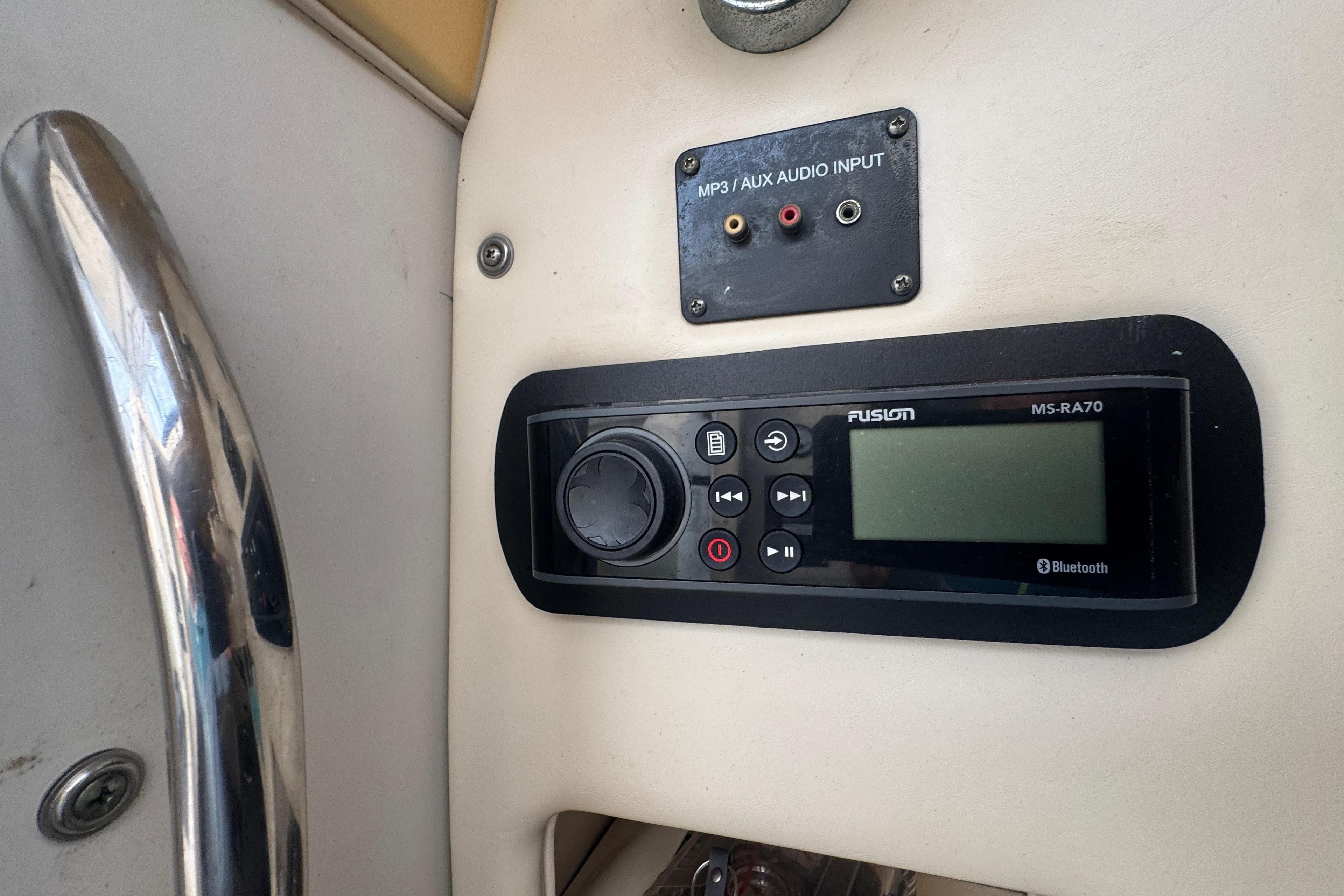 Audio system controls on a 2007 Grady-White Marlin 300 boat dashboard.