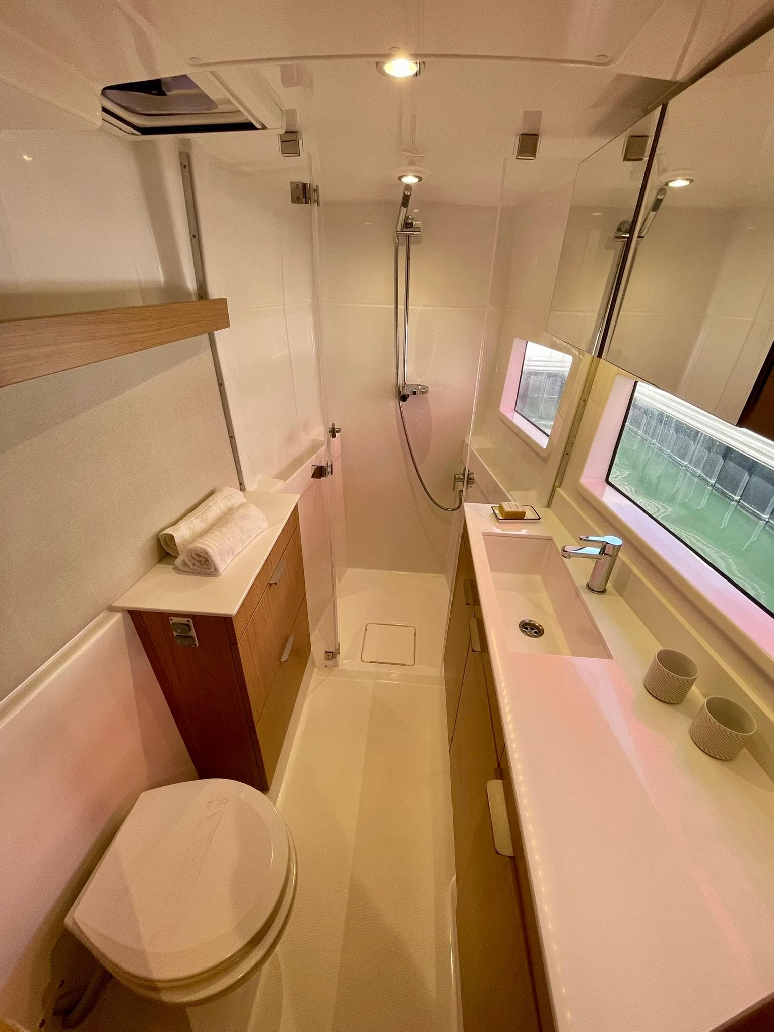 Modern bathroom in 2026 Bali CATSMART yacht with sleek fixtures and natural lighting.