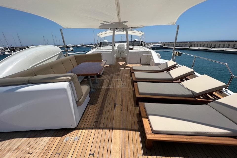 Luxurious 1984 W.A. Souter & Sons yacht deck with sun loungers and seating area.