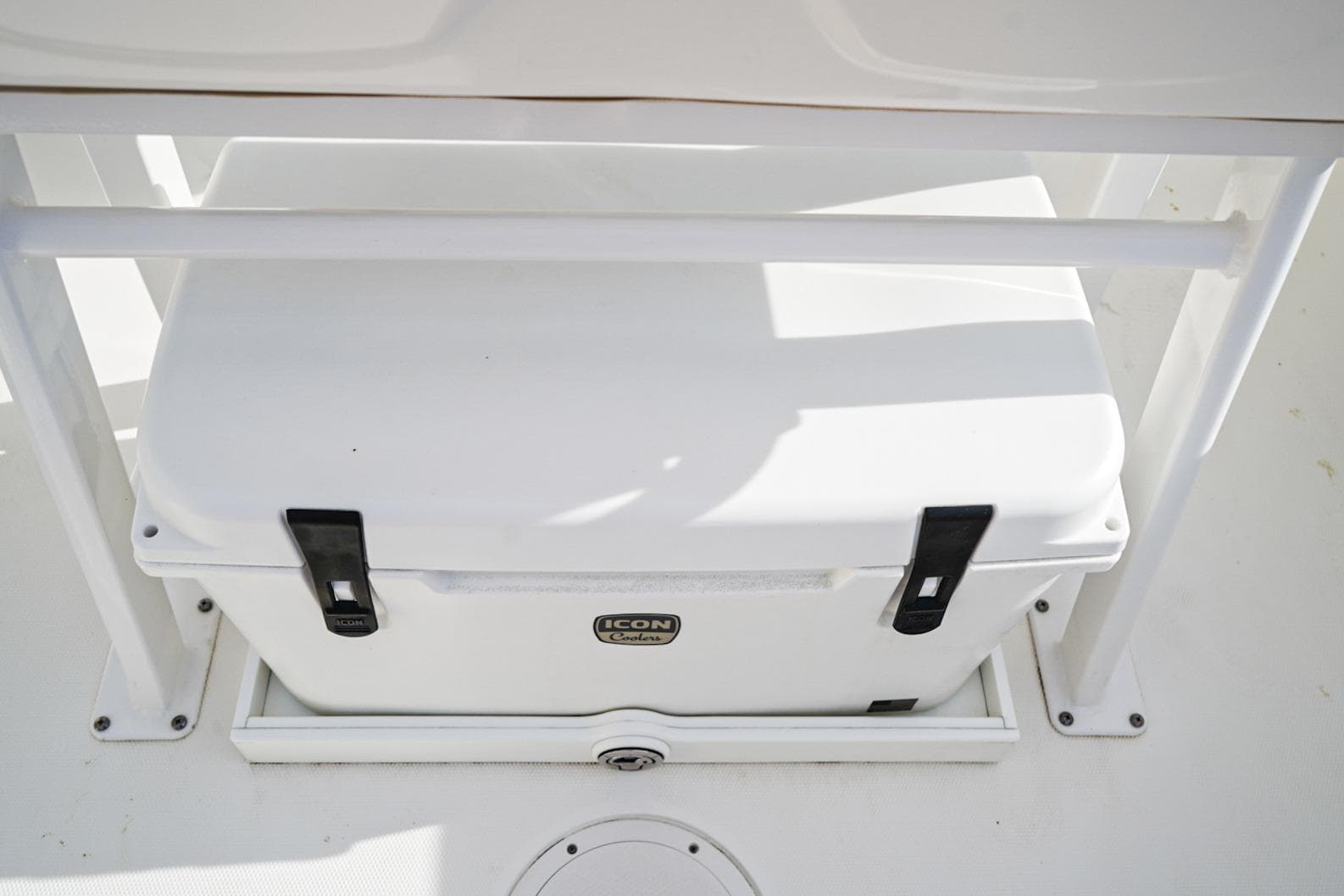 White Icon cooler on 2021 Edgewater 230CC boat deck.