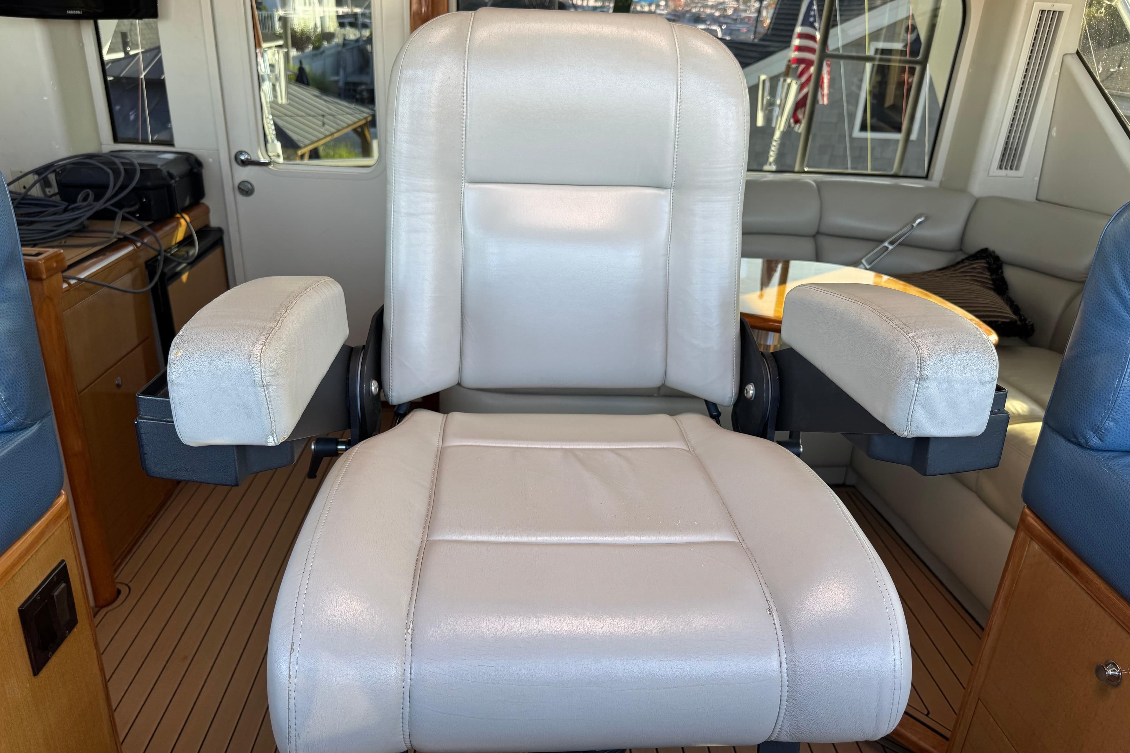 Captain's chair in 2002 Viking 61 Enclosed Bridge yacht interior.