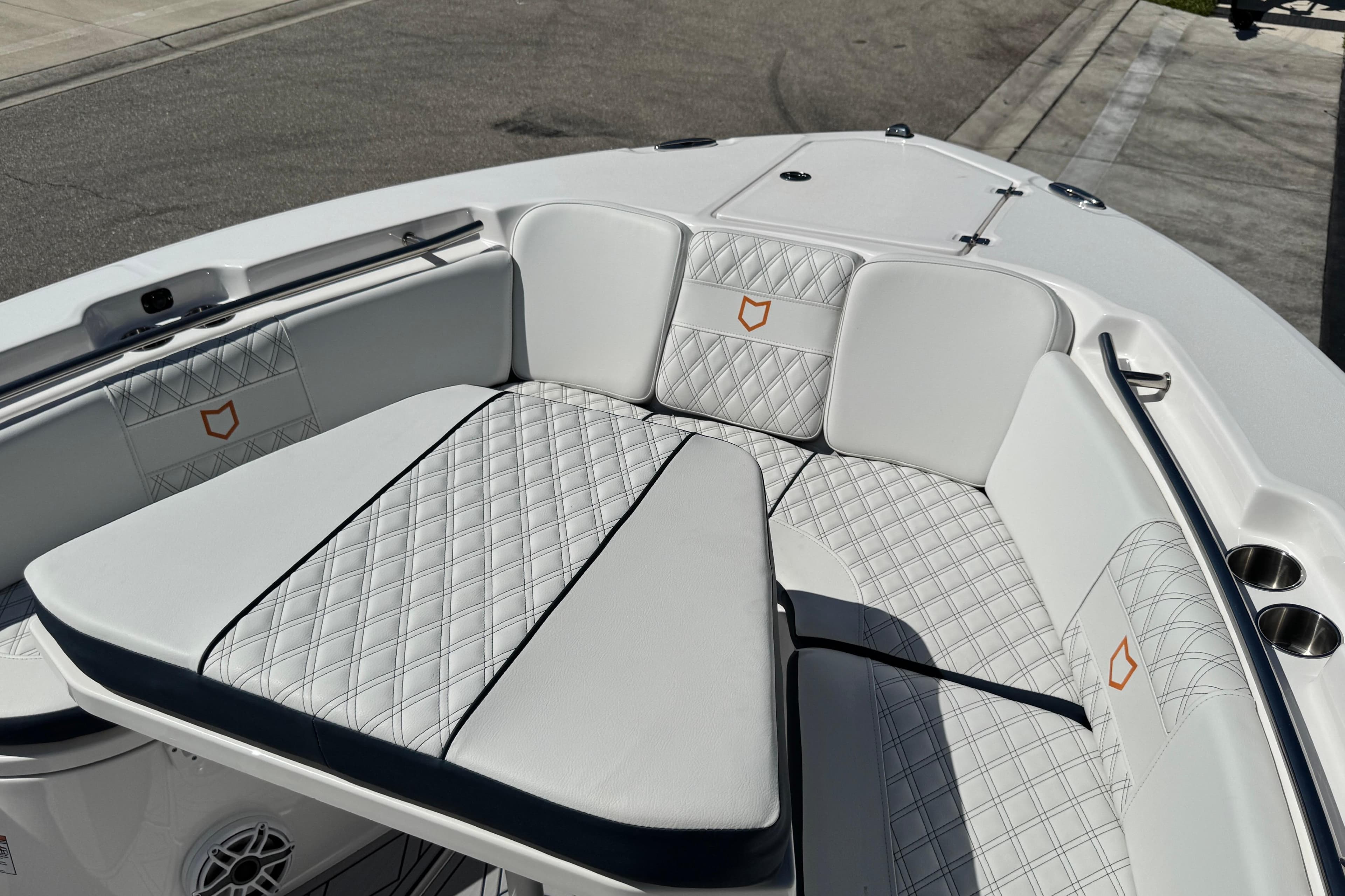 2025 Sea Fox 288 Commander boat interior with white quilted seating and stainless steel accents.