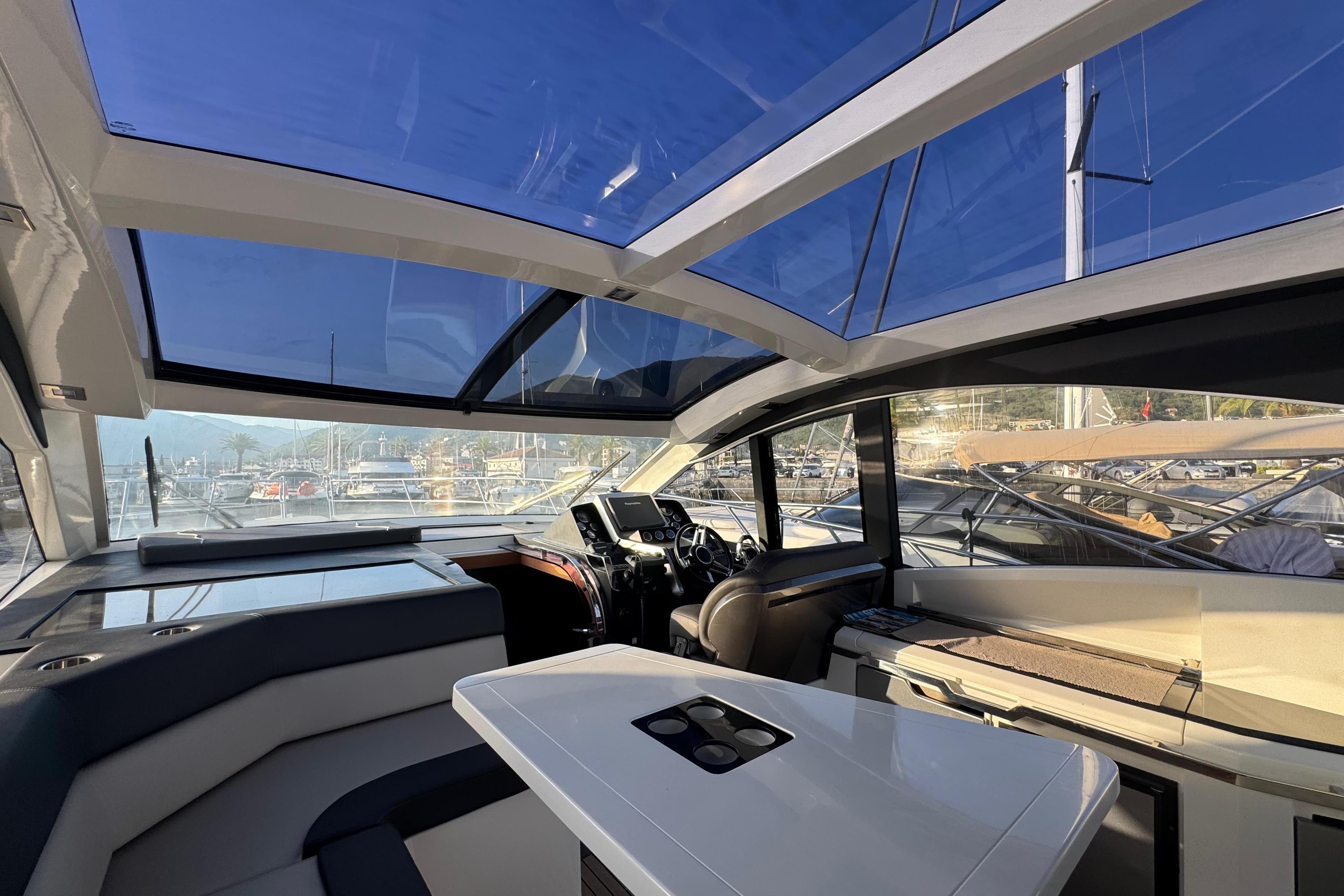 Interior view of 2015 Galeon 445 HTS yacht with sleek design and panoramic windows.