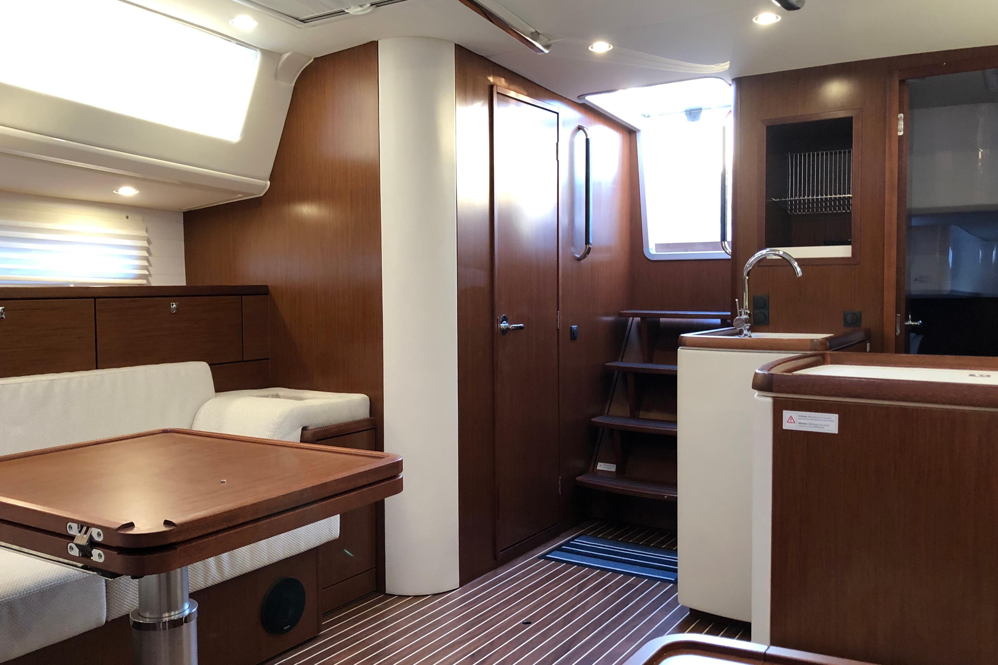 Interior of 2015 Bavaria Vision 46 yacht with wooden furnishings and modern design.
