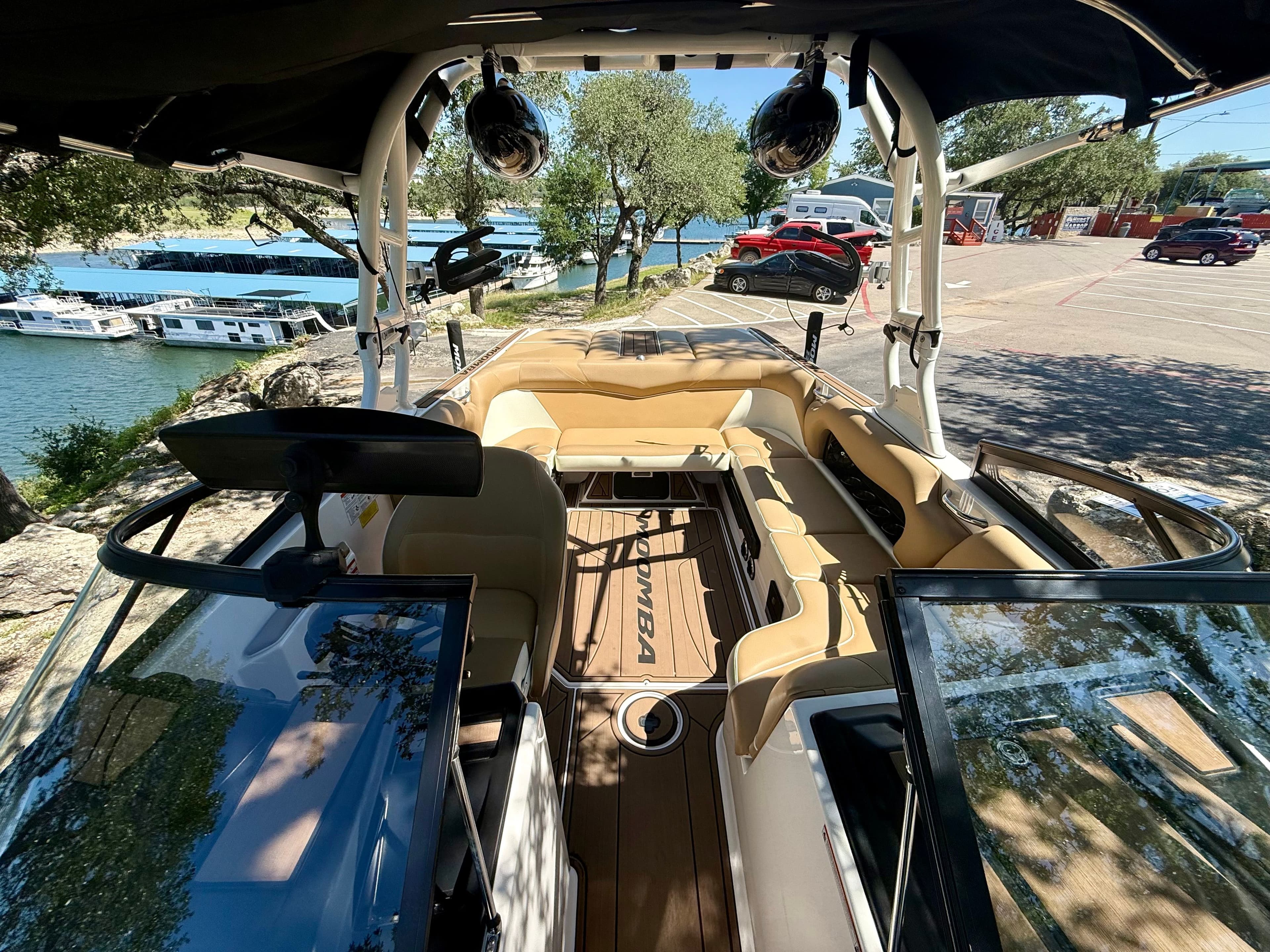 Interior view of a 2019 Moomba Craz boat by the water.