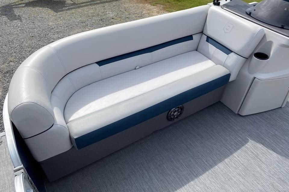 Luxurious seating on 2022 Godfrey Sweetwater 2286 SBX pontoon boat, featuring plush upholstery.