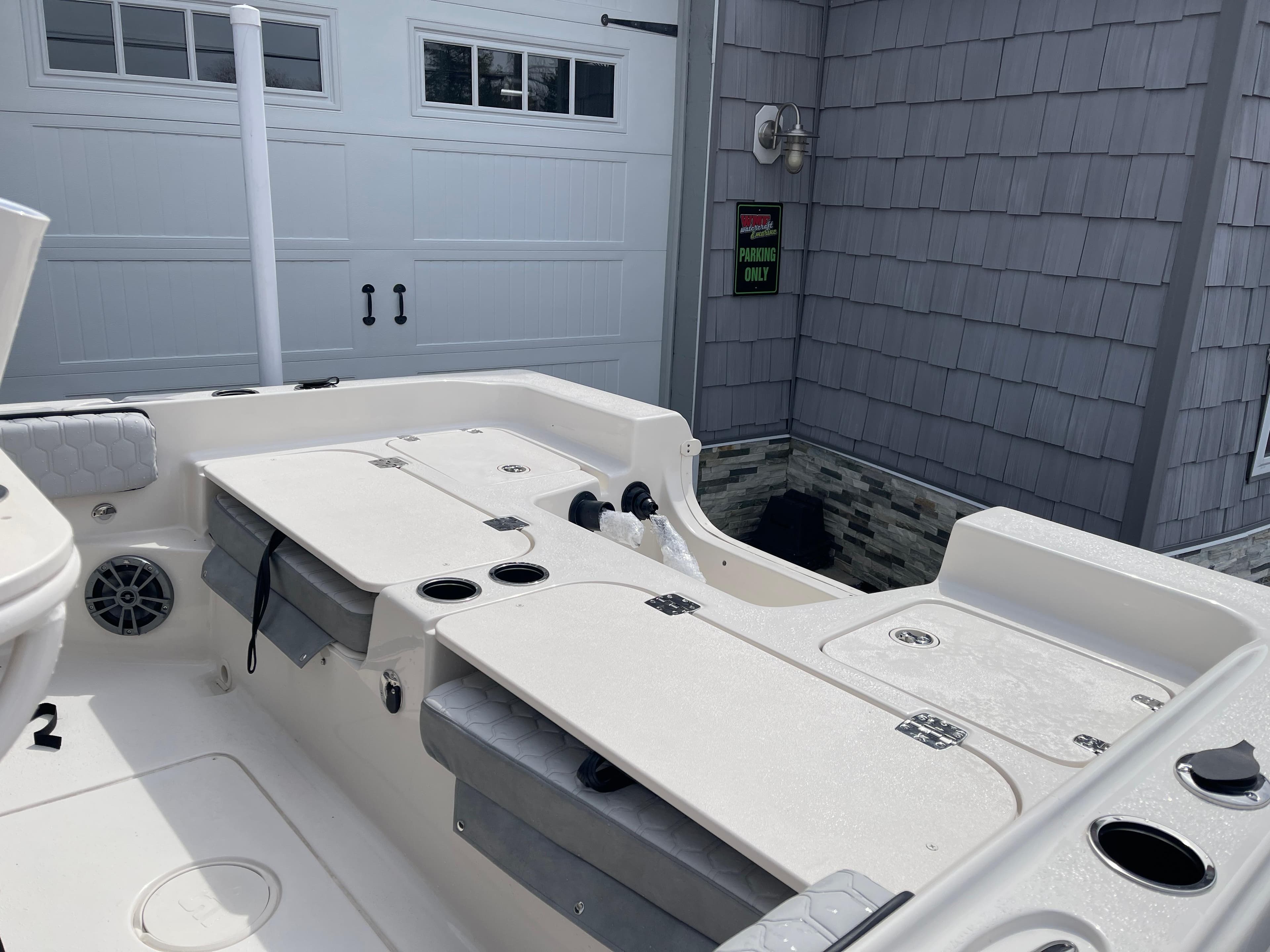 2025 Carolina Skiff 21 Ultra Elite boat interior with seating and storage compartments.