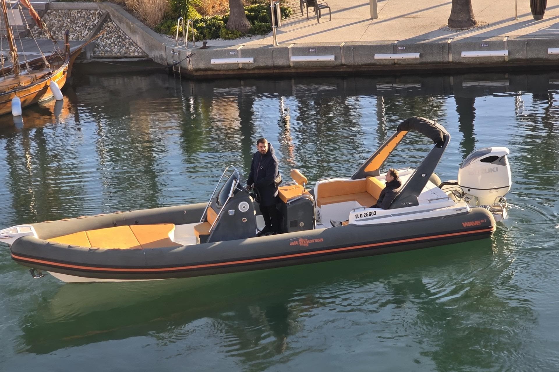 Altamarea WAVE 27 boat, 2021 model, cruising in a calm marina.