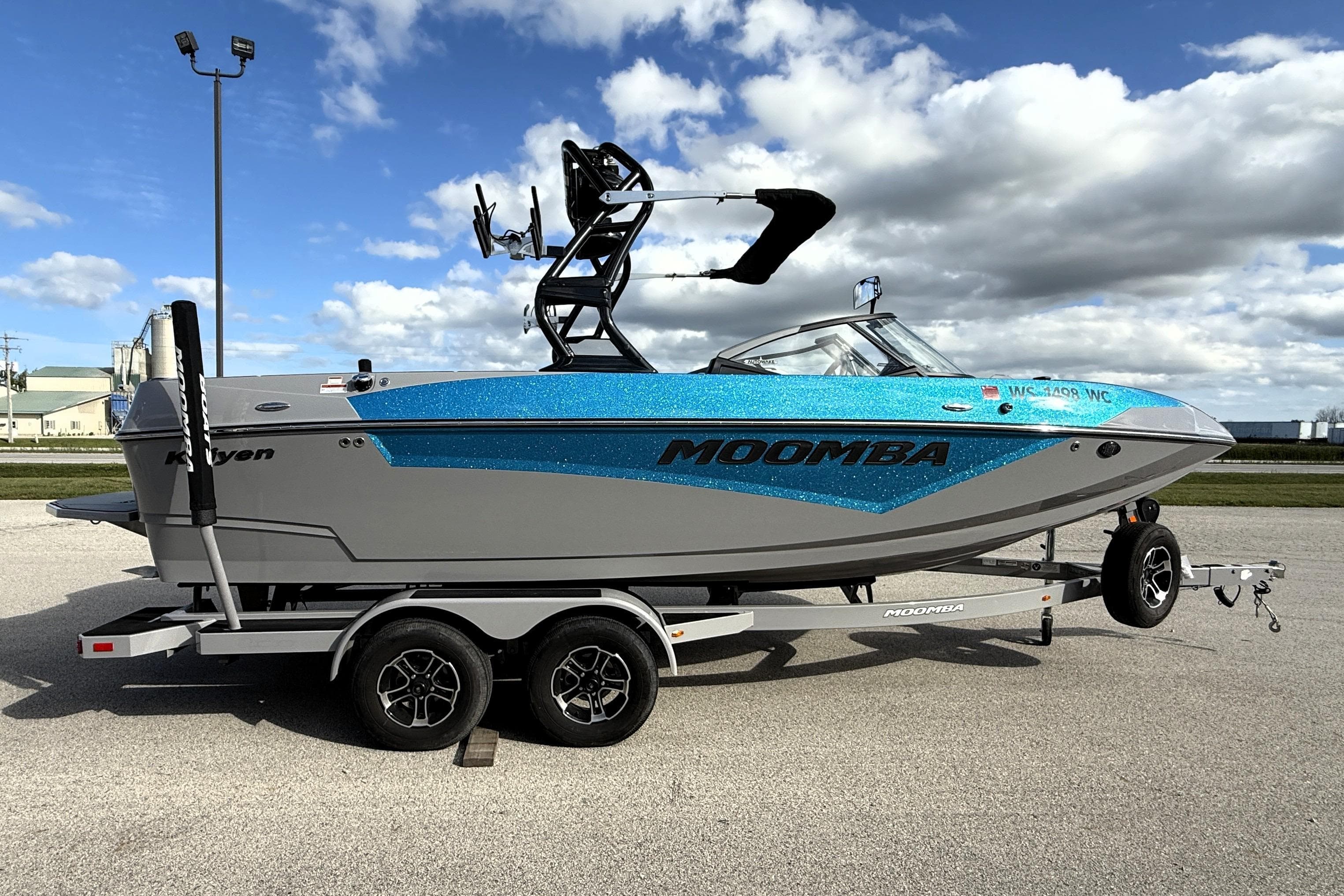 2022 Moomba Kaiyen boat on trailer under cloudy sky.