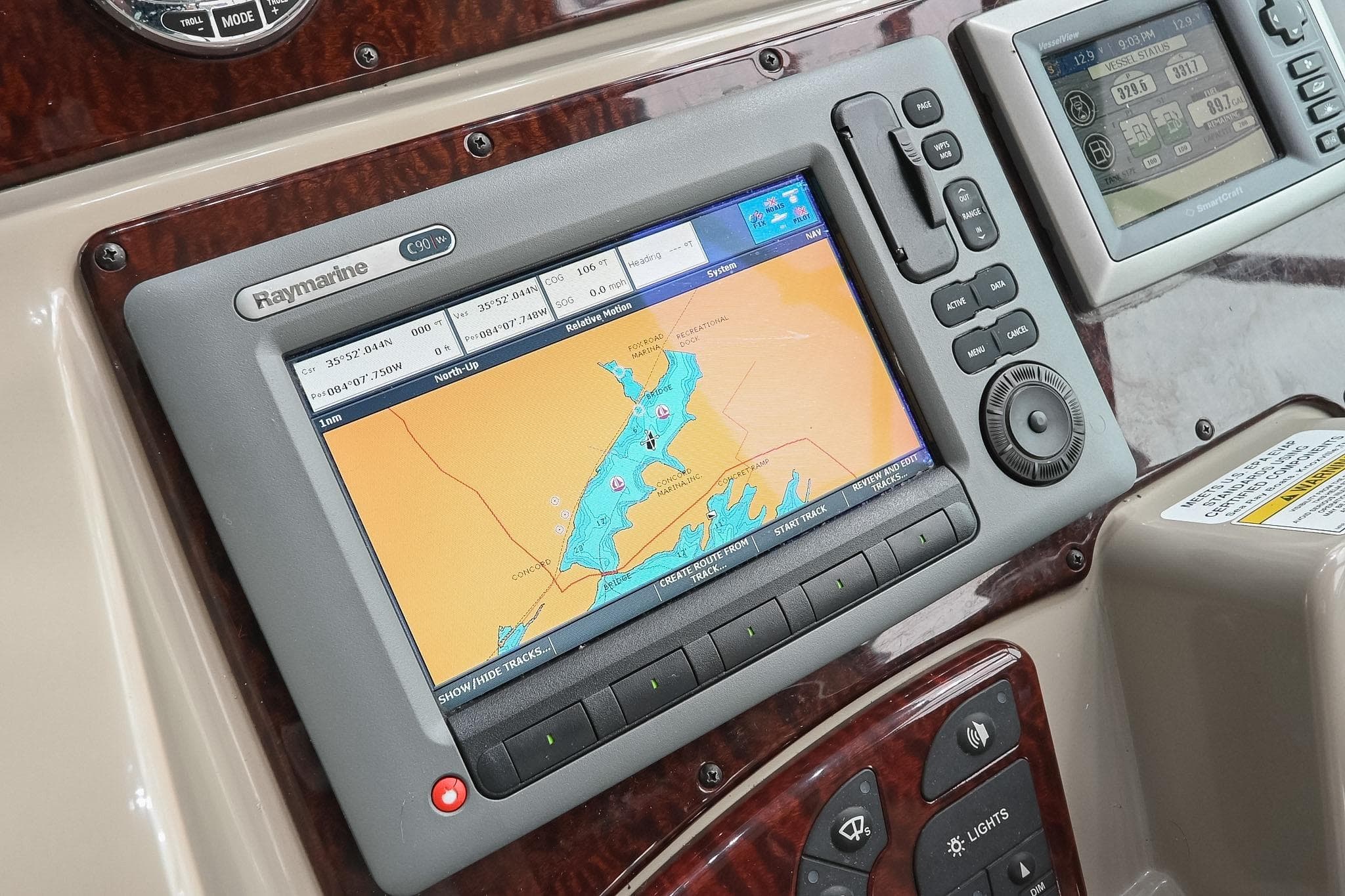 Raymarine navigation system on 2012 Sea Ray Sundancer 330 boat dashboard.
