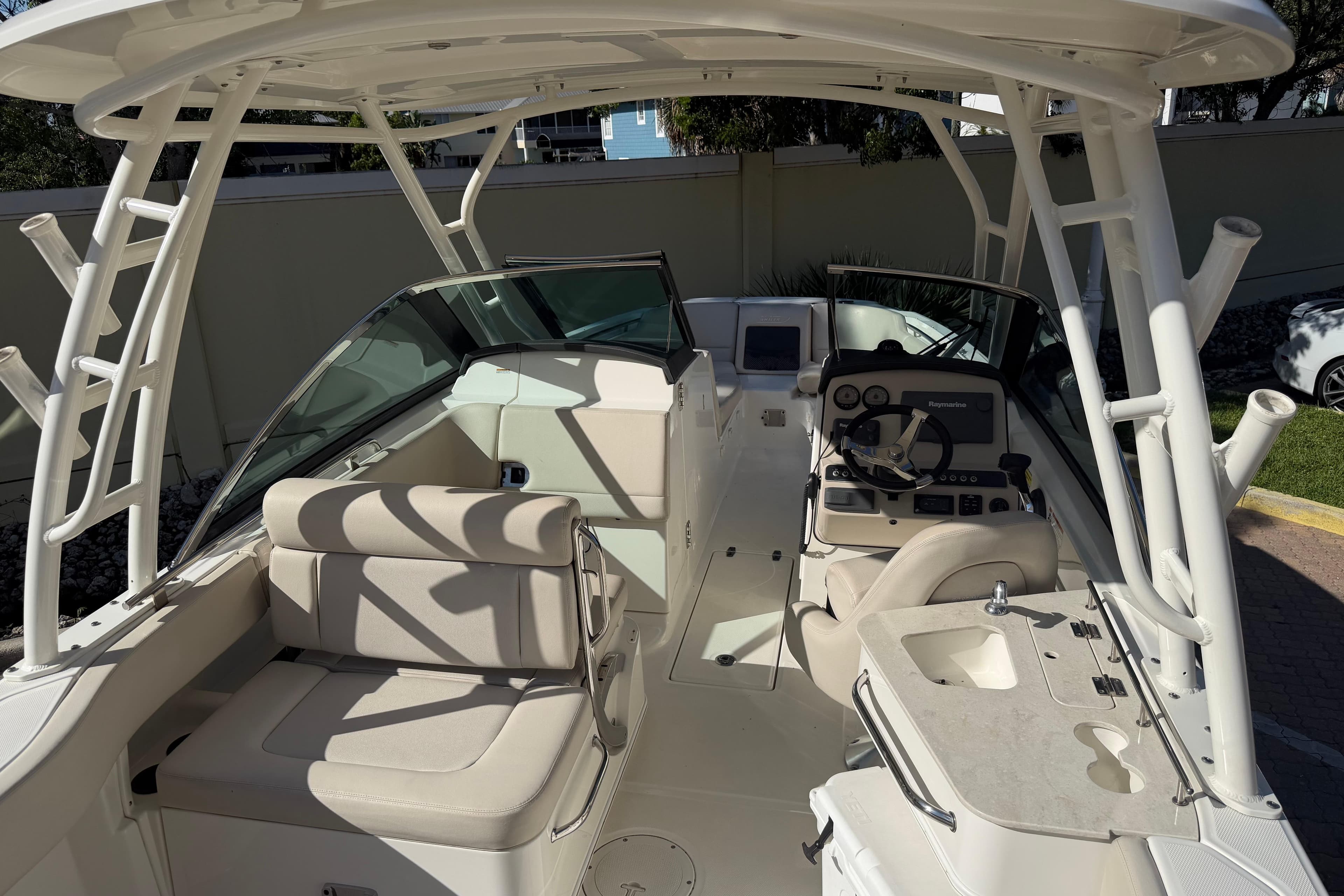 2016 Boston Whaler 230 Vantage boat interior with seating and helm station.