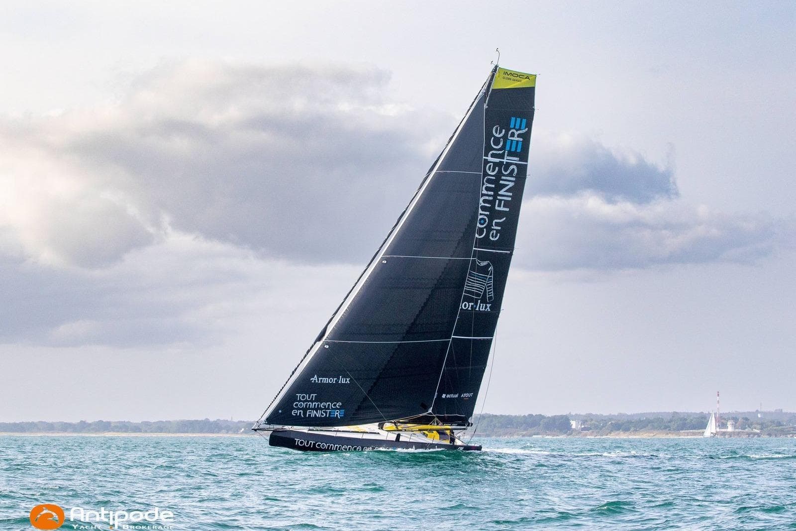 Sailing yacht Persico Imica 2023 gliding on the ocean under cloudy skies.