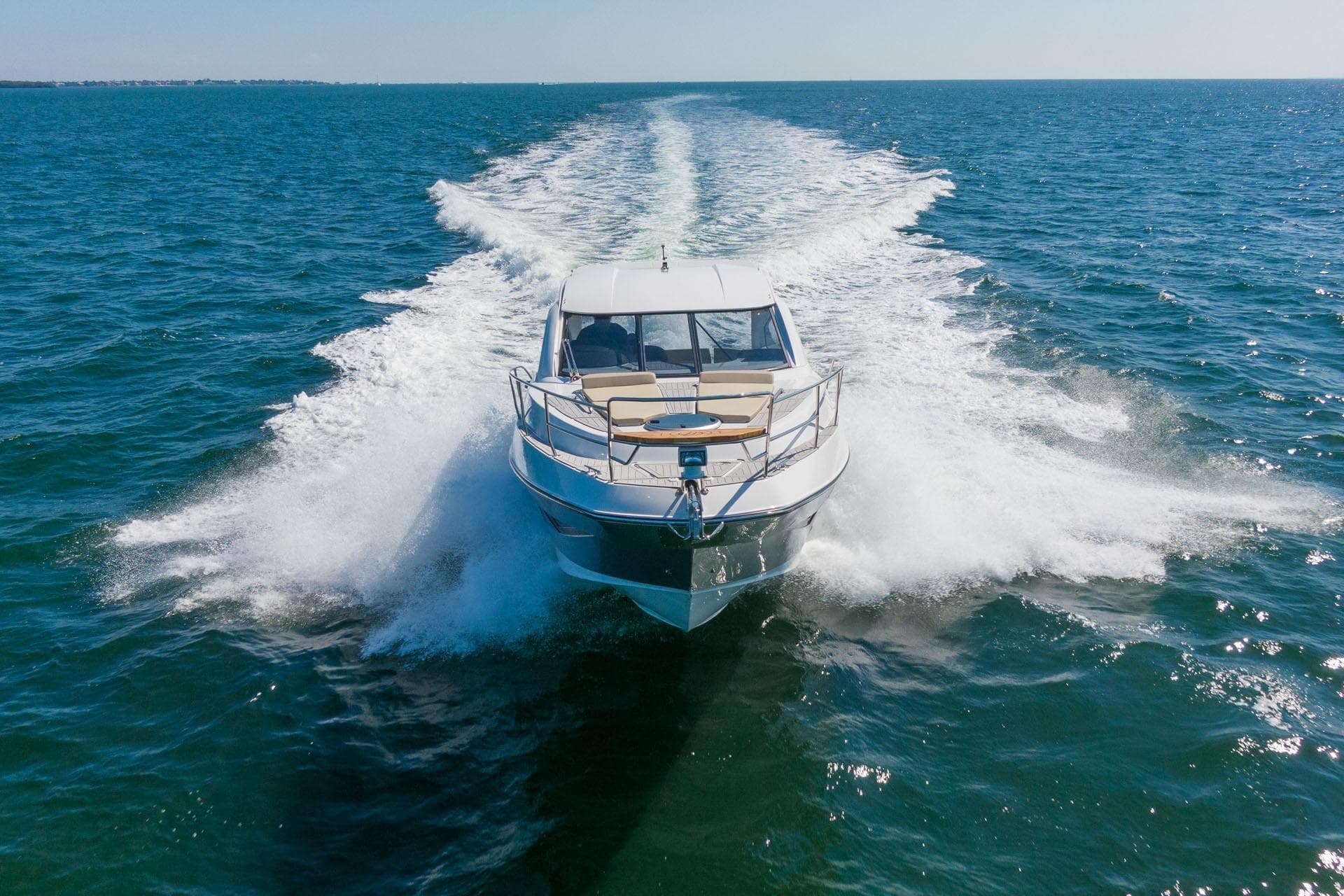 2026 Hanover 375 yacht cruising on open sea, creating a dynamic water trail.