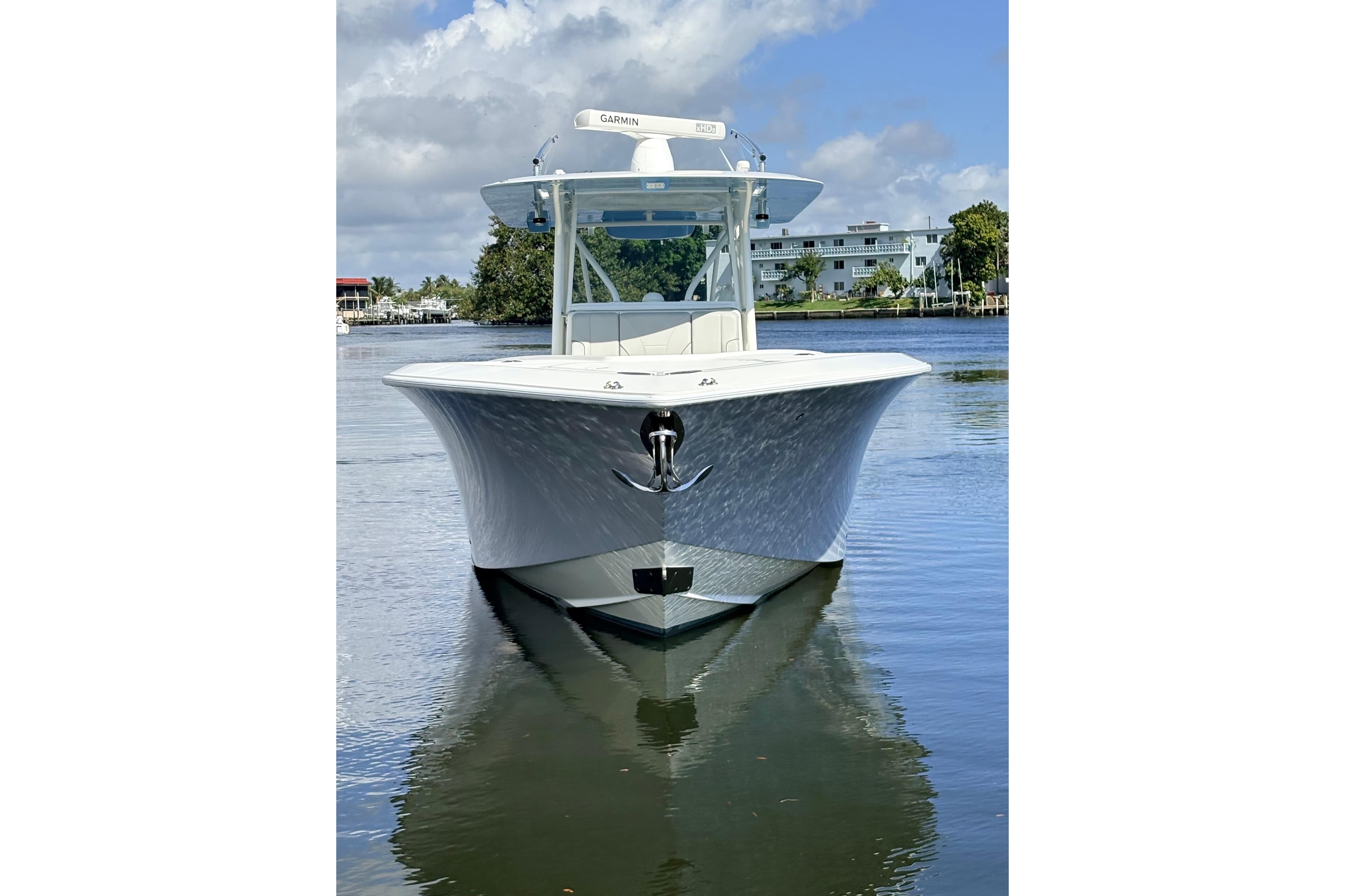 2017 SeaVee 370Z boat on calm water, front view, clear sky background.
