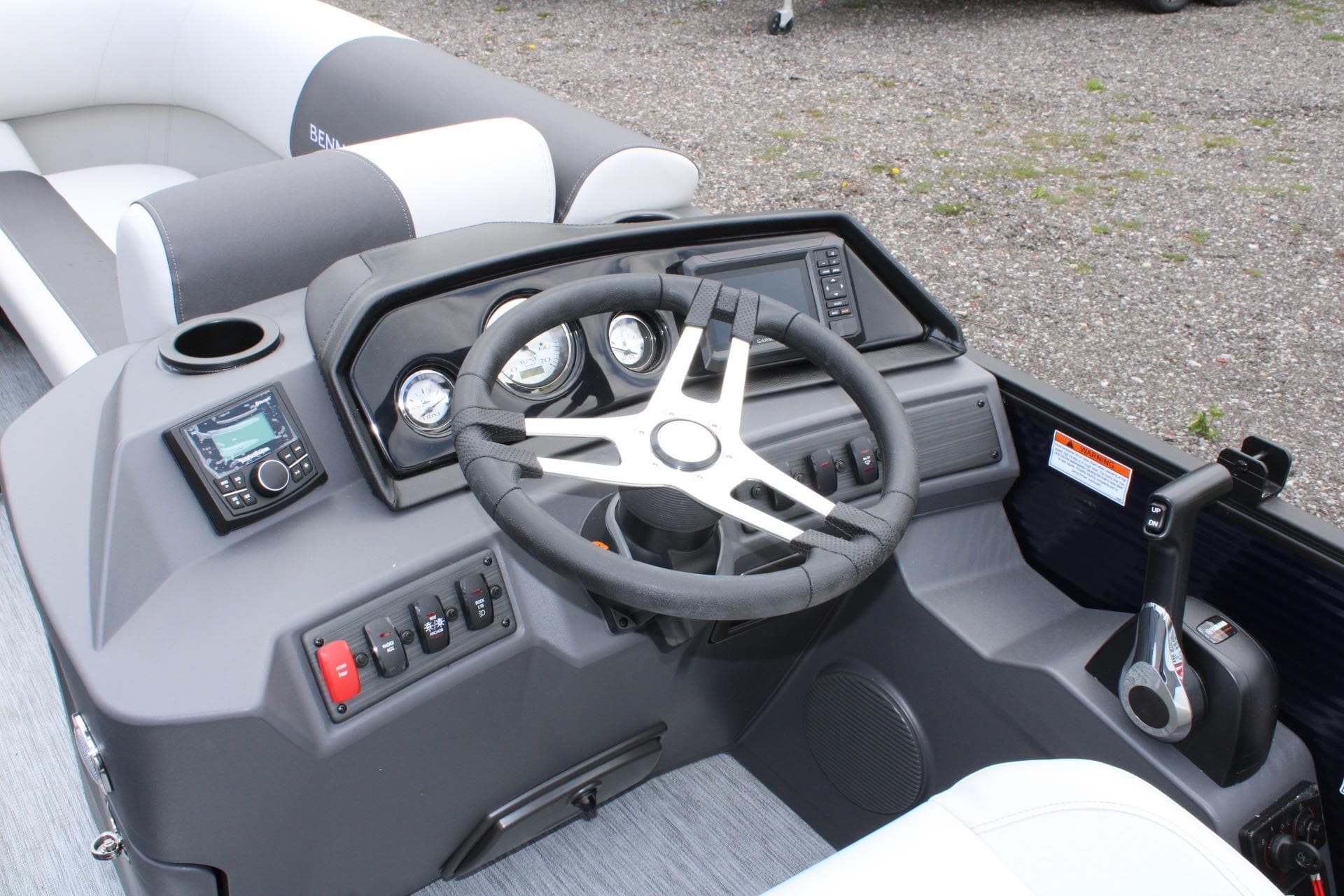 2026 Bennington 22 SSRSF boat dashboard with steering wheel and control panel.