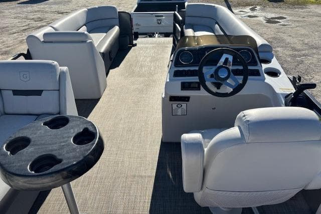 2022 Sweetwater 2286 pontoon boat interior with plush seating and modern dashboard.