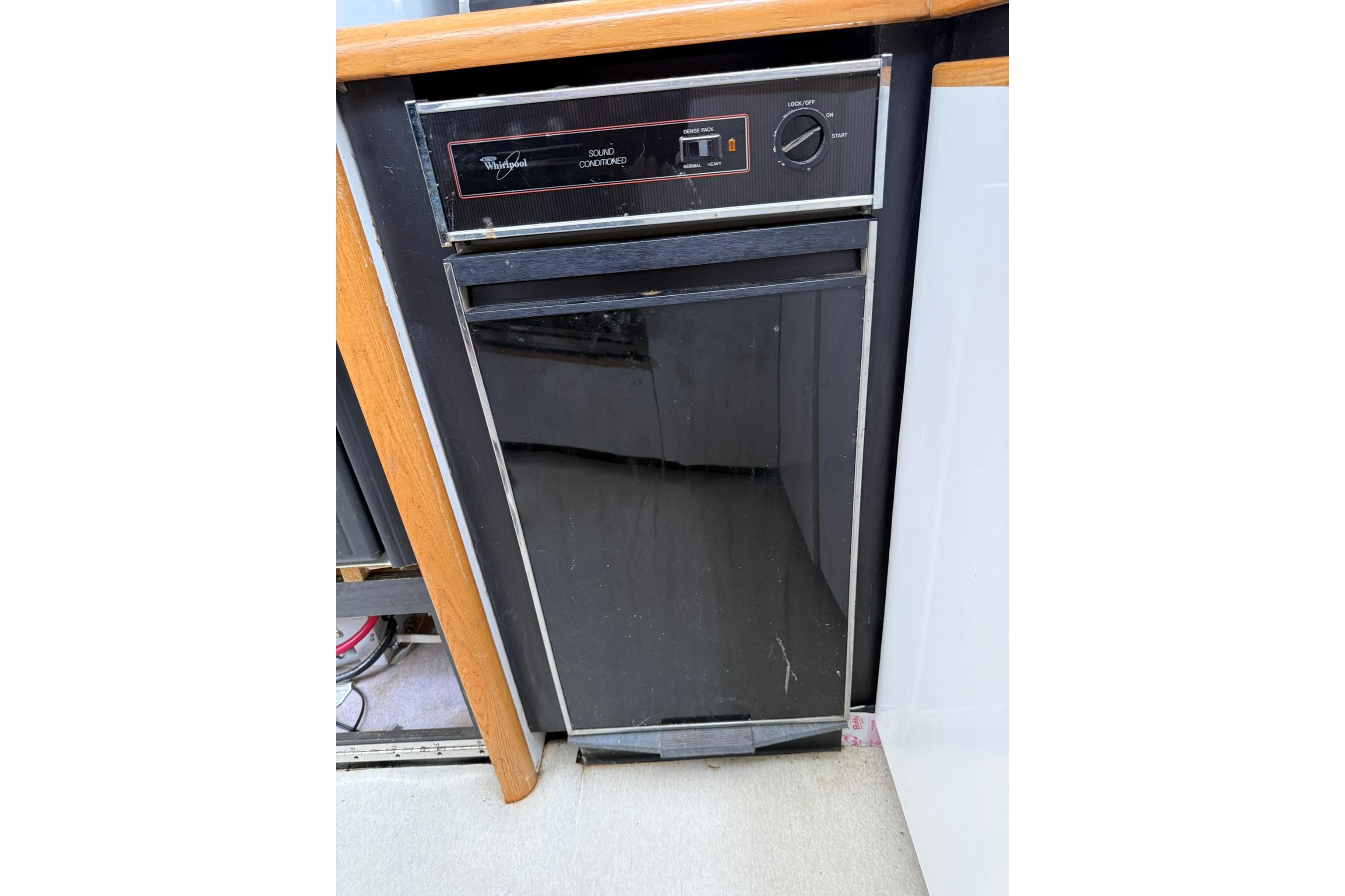 Whirlpool trash compactor in 1991 Bayliner 4387 Motoryacht kitchen area.