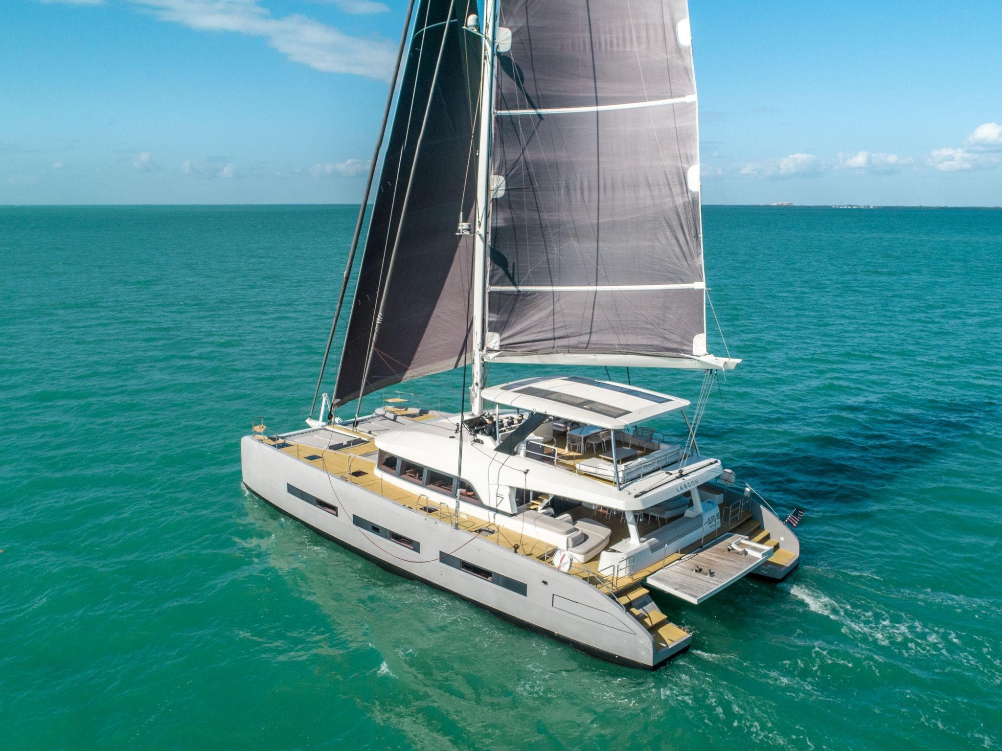 Luxury Lagoon SEVENTY 7 catamaran sailing on turquoise waters, 2020 model.