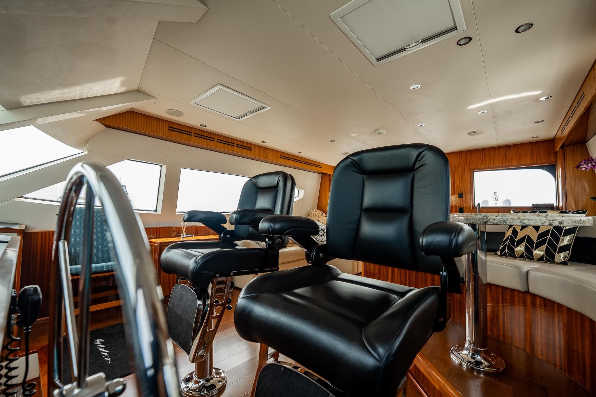 Luxurious interior of 2012 Hatteras 80 Motor Yacht with plush seating and elegant design.