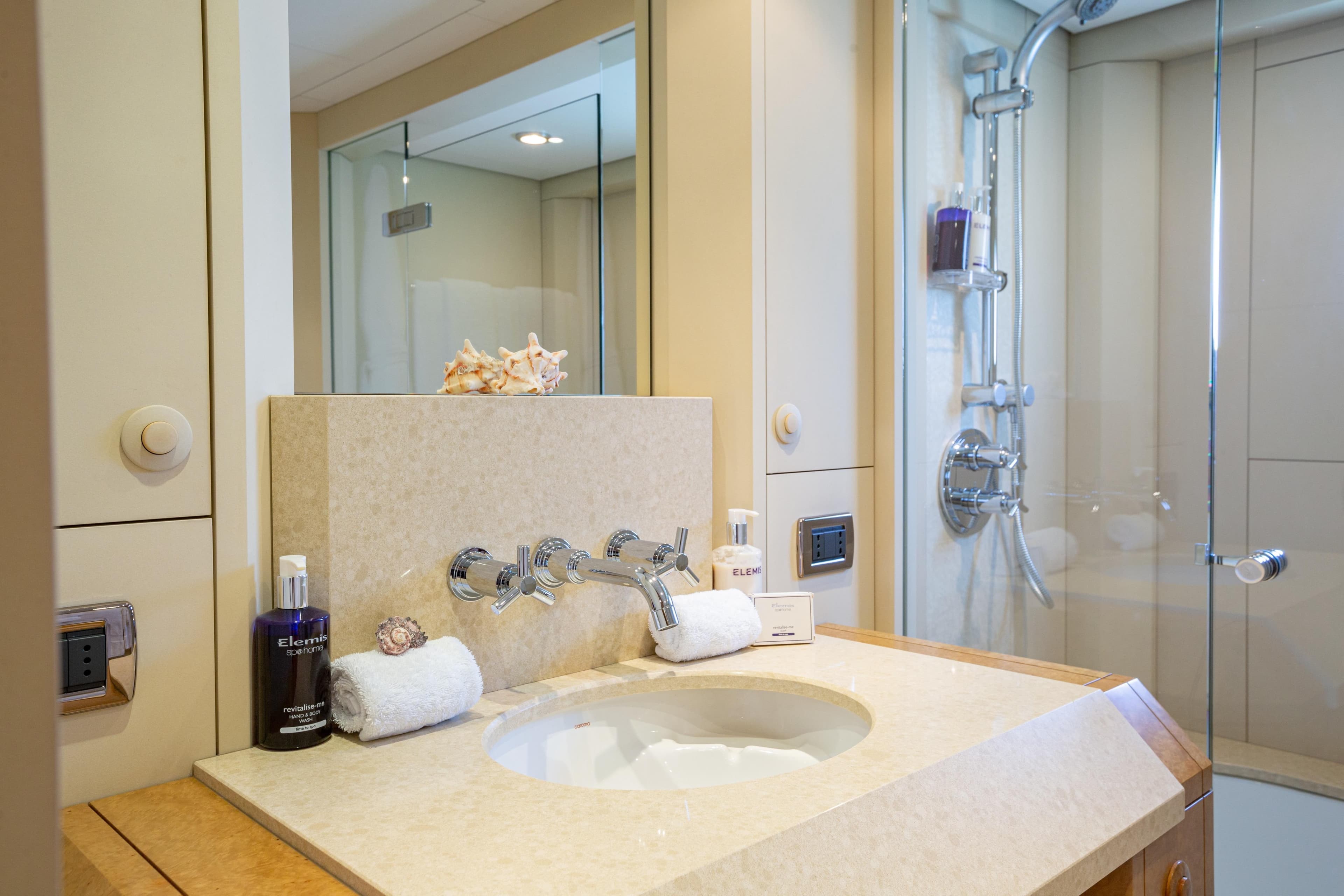 Luxurious bathroom on 2005 Evolution Yachts Custom, featuring elegant fixtures and modern amenities.