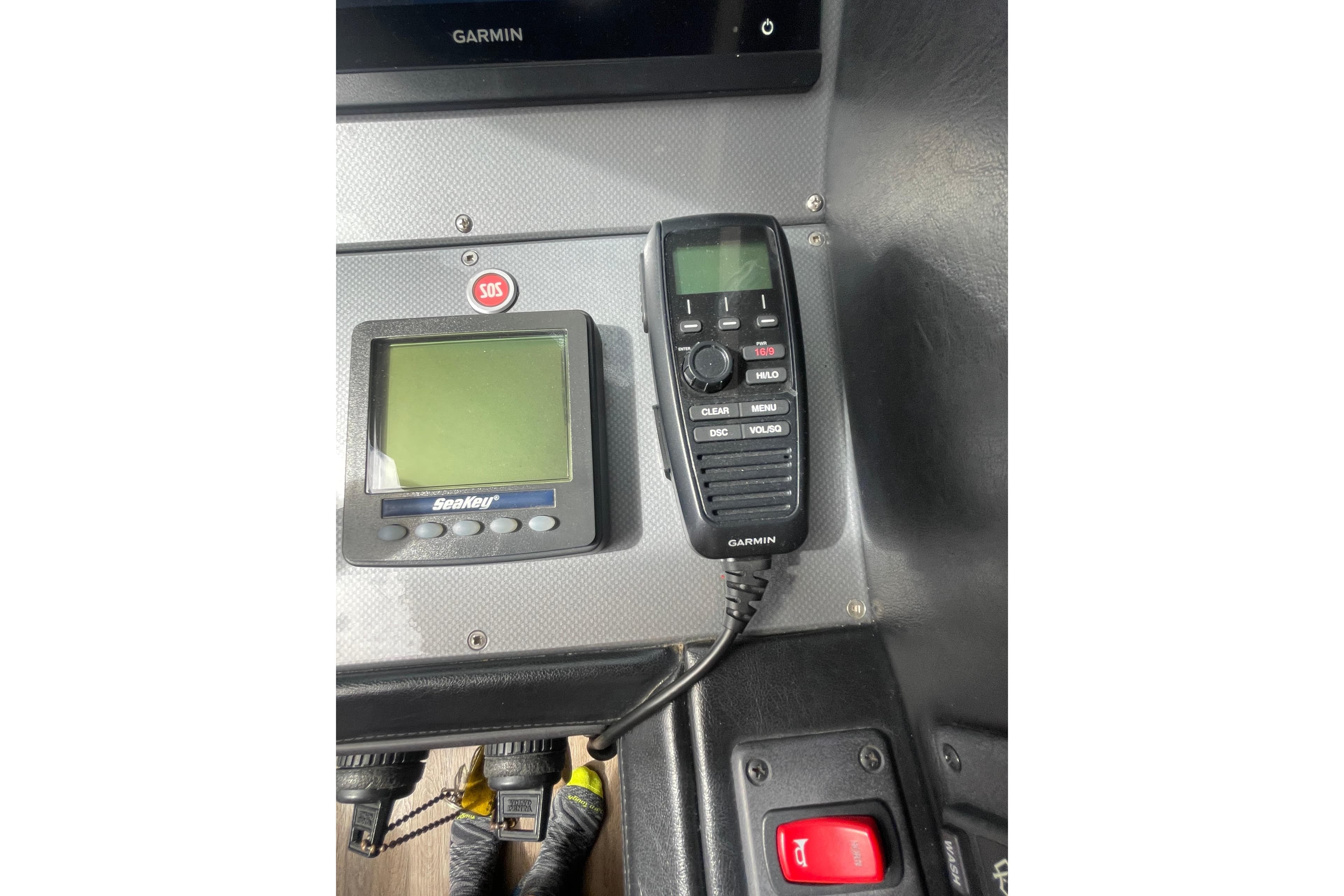 Control panel of a 2008 Marquis 40 SC yacht with Garmin and SeaKey devices.