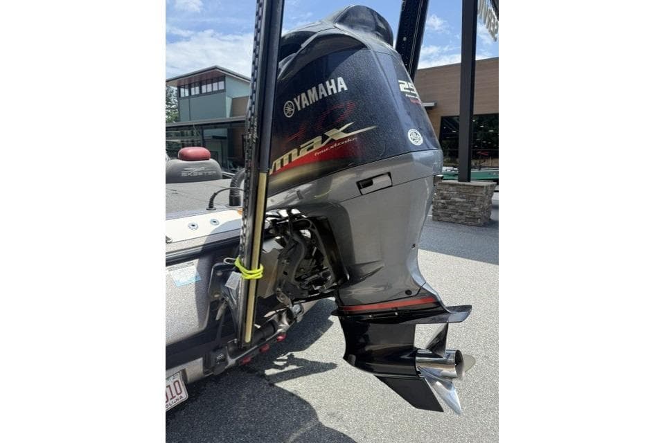 Yamaha outboard motor on 2013 Skeeter FX21 boat, parked outdoors.