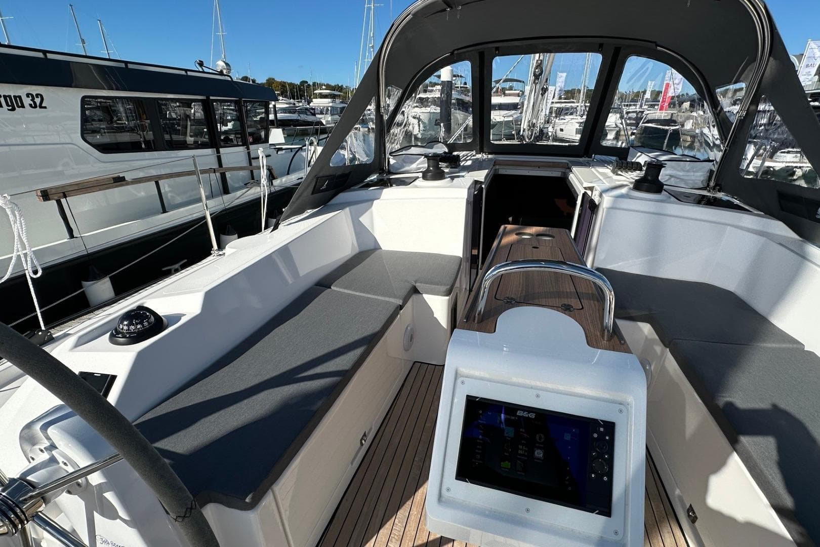 2025 Bavaria C38 yacht cockpit with modern navigation system and comfortable seating.
