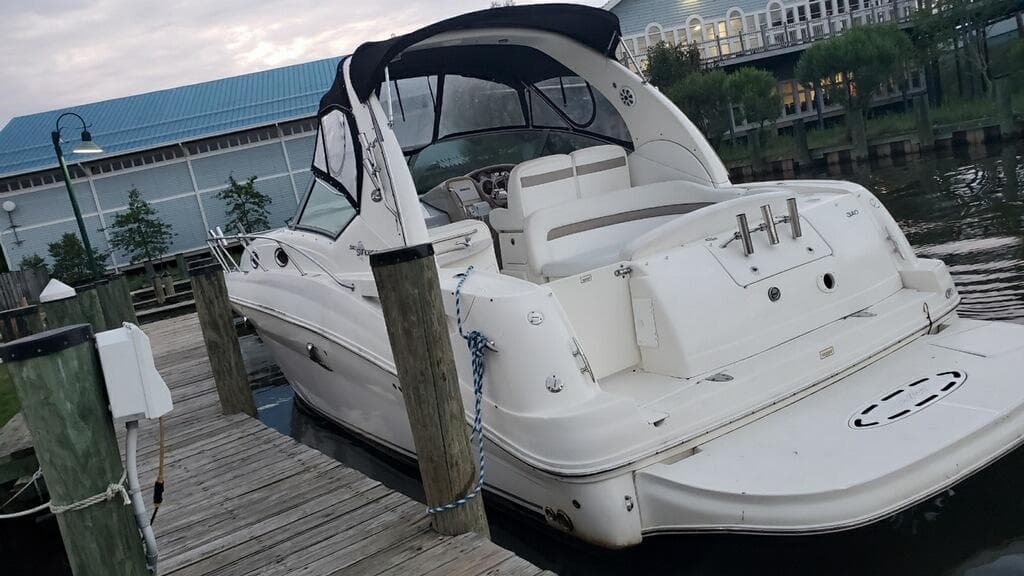 2005 Sea Ray 320 Sundancer docked at a marina.