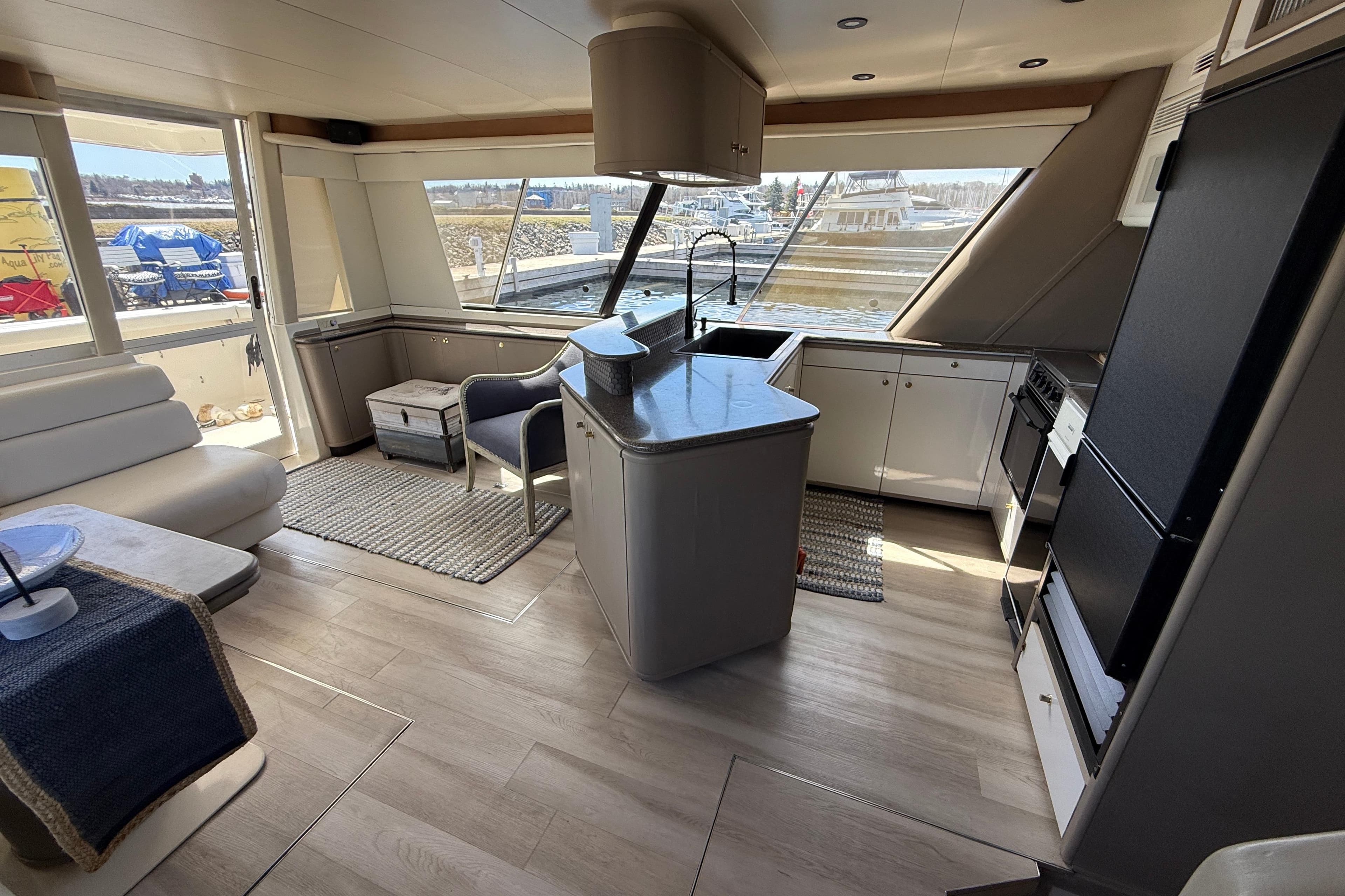 Interior of 1997 Bayliner 4788 Pilot House Motoryacht with modern kitchen and seating area.