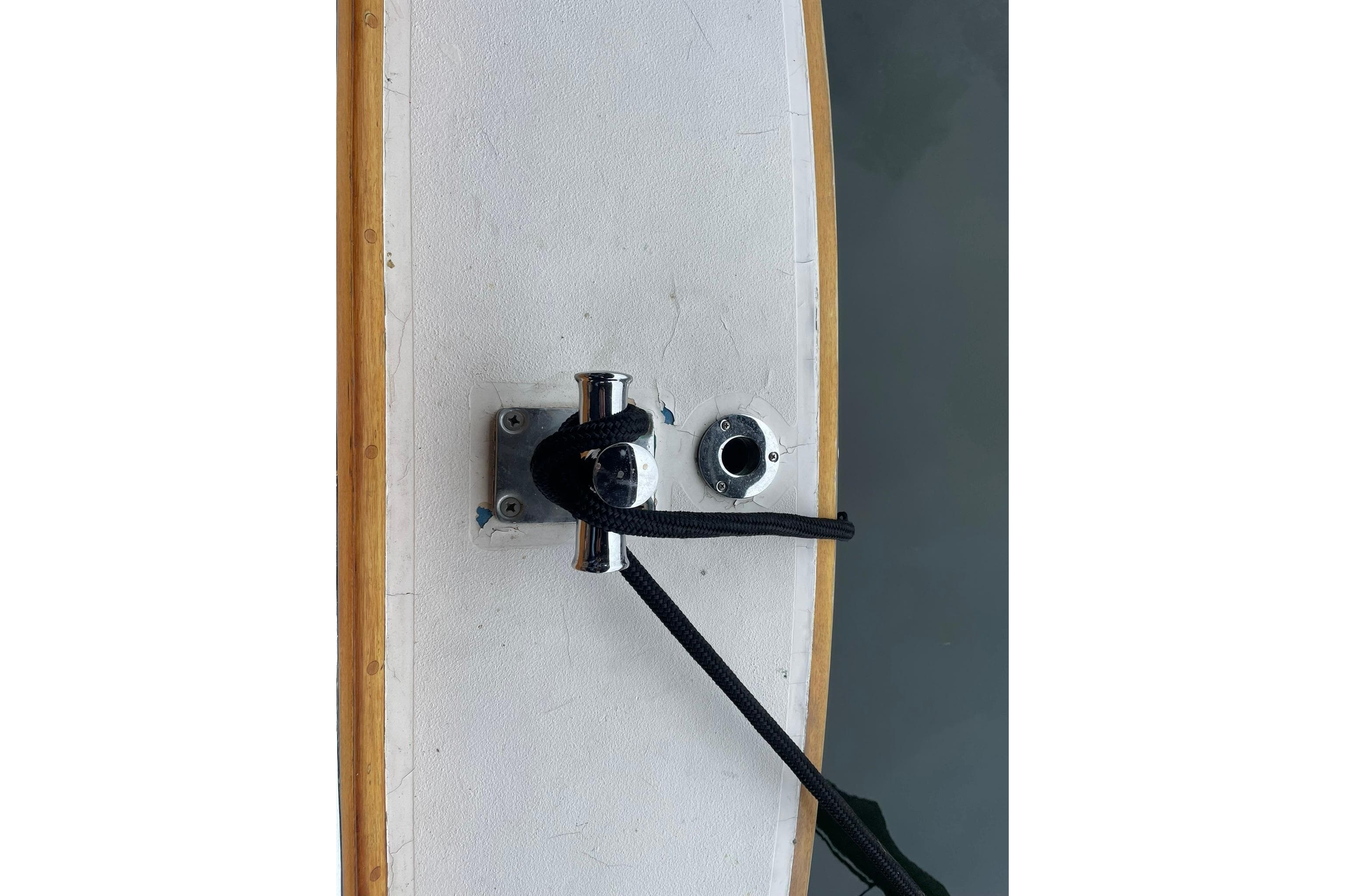 Vintage 1948 Grandy 34 boat deck with cleat and rope detail.
